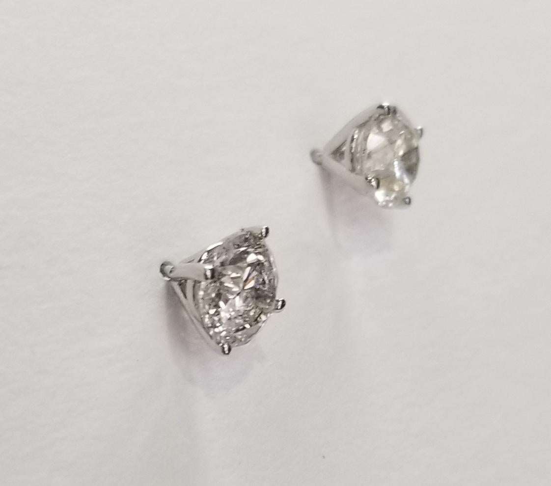 Diamond stud earrings, containing 2 brilliant cut diamonds; color 