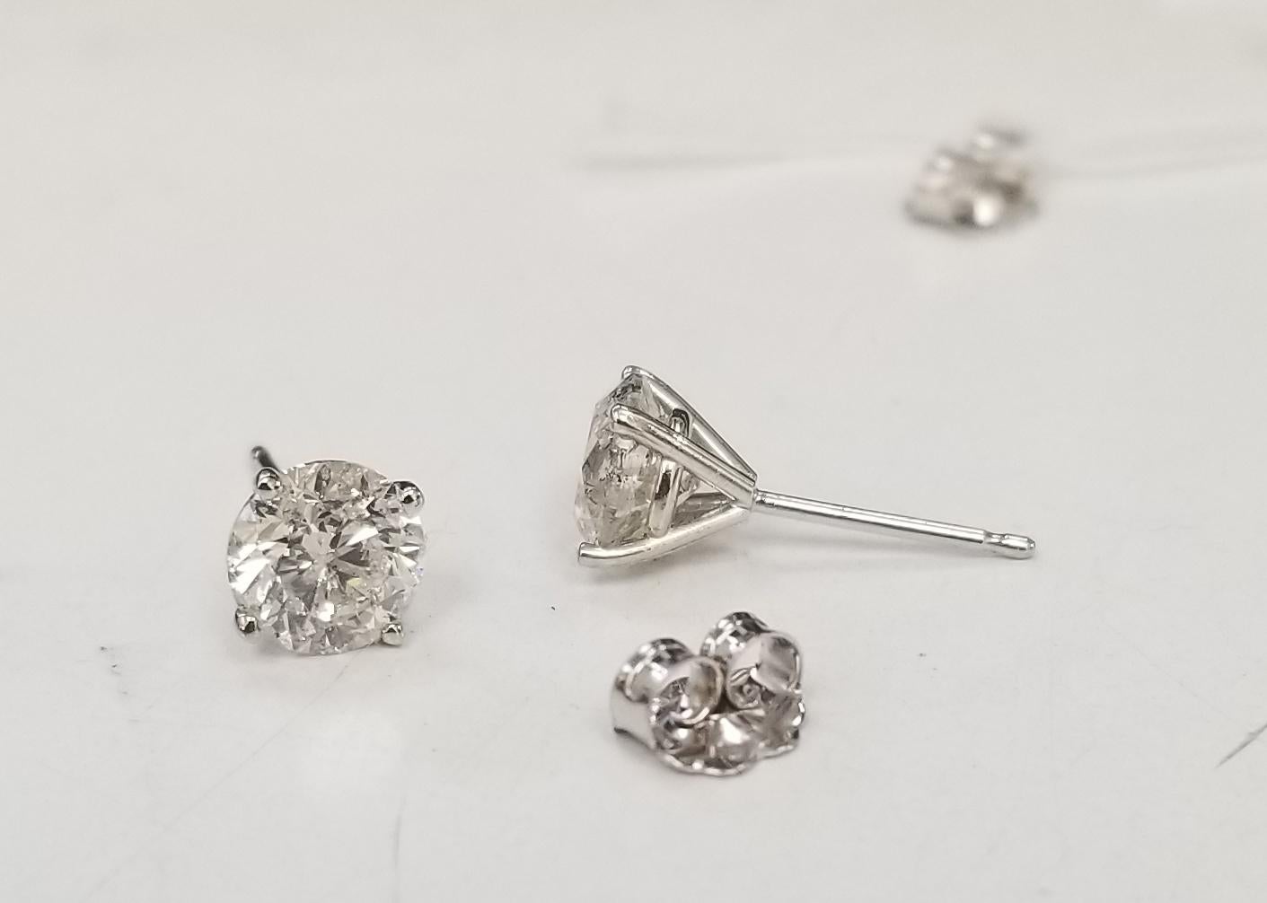Modern Diamond Stud Earrings, Containing 2 Brilliant Cut Diamonds 2.02 Carats For Sale