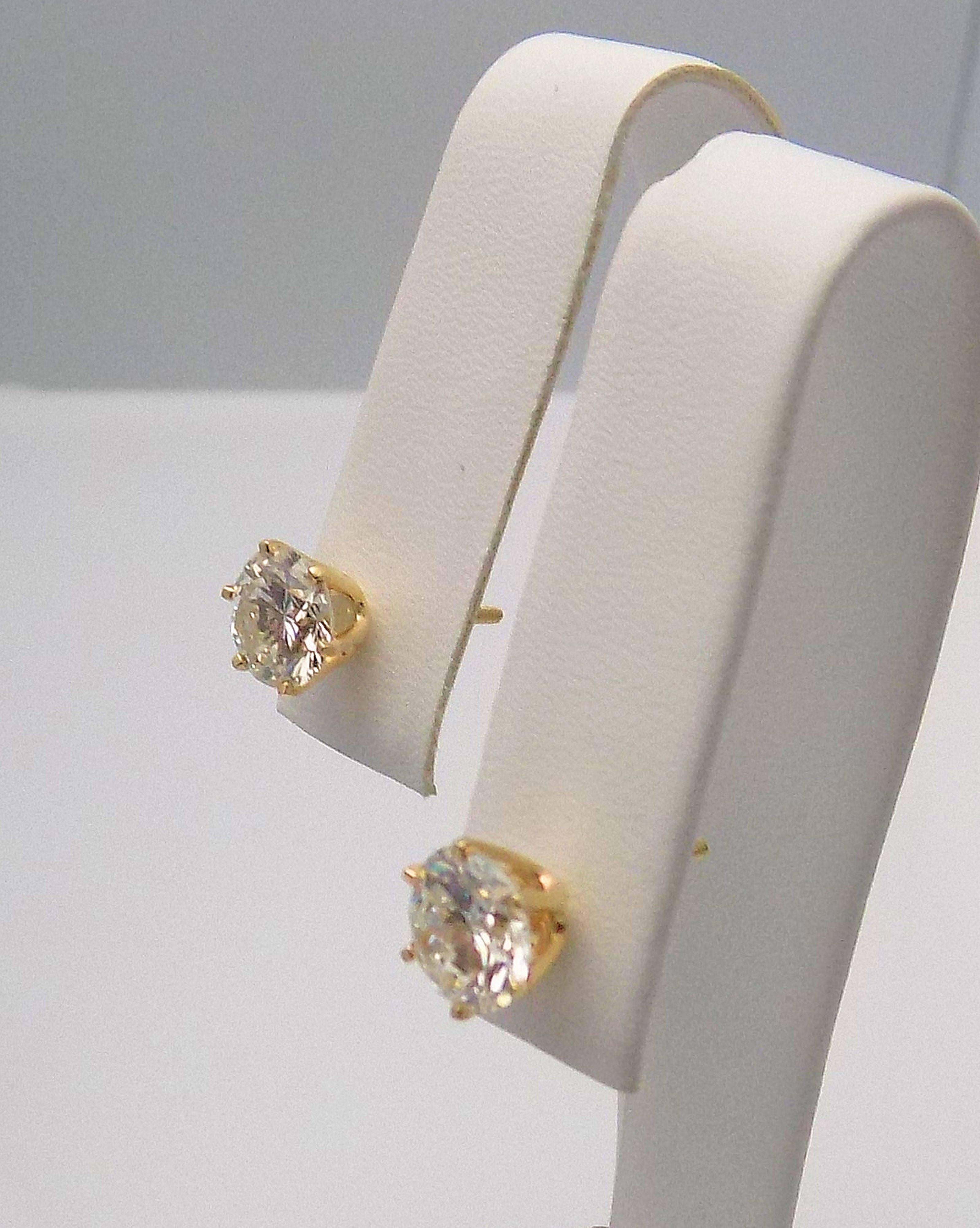 Pair 14 Karat Yellow Gold and Diamond Stud Earrings with Screw Backs. 2 Round Brilliant Diamonds 2.75 Carat Total Weight, Laser Treated I-1, I-J. 1.1 DWT or 1.71 Grams.