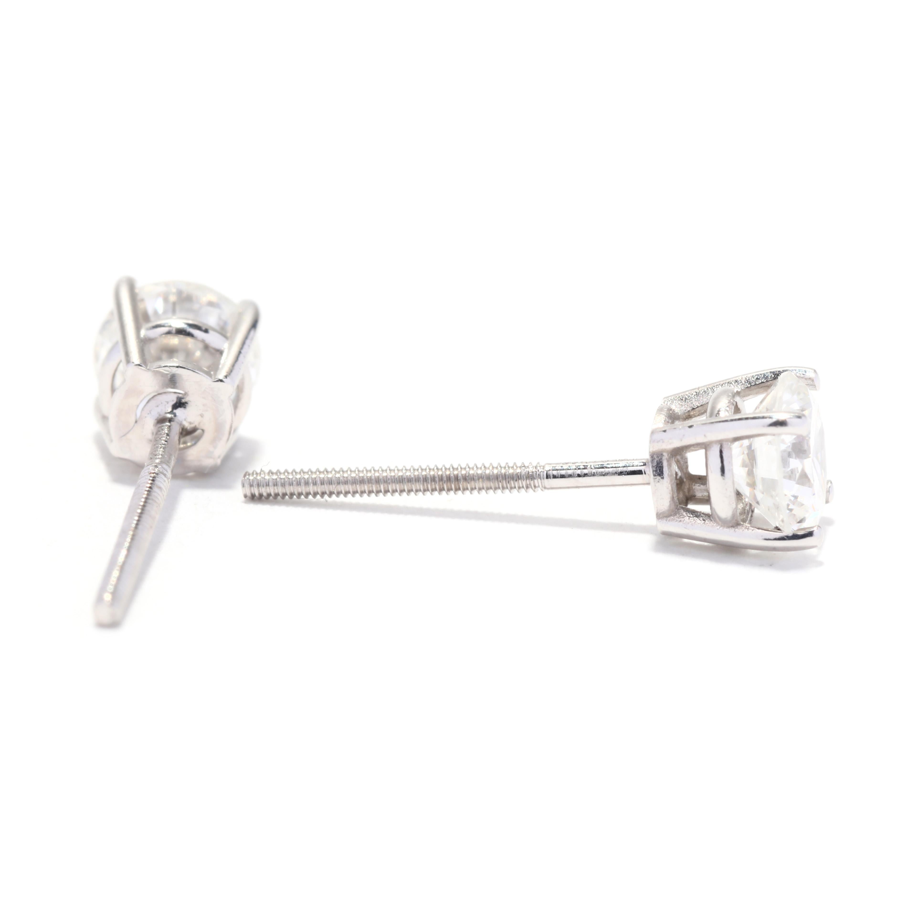A pair of platinum diamond stud earrings. This simple diamond stud earrings feature prong set, round brilliant cut diamonds weighing approximately .75 total carats and with pierced screw backs.

Stones:
- diamonds, 2 stones
- round brilliant cut
-