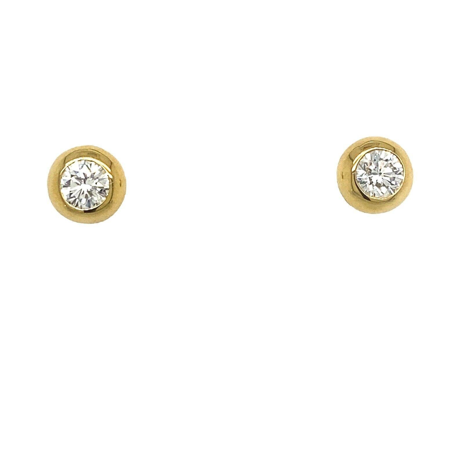 These stunning Diamond earrings are the perfect pair to add to your collection. They are set in 18ct Yellow Gold. The pair is set with 2 Round Brilliant Cut Diamonds, with a total diamond weight of 0.65ct in rubover setting.

Additional