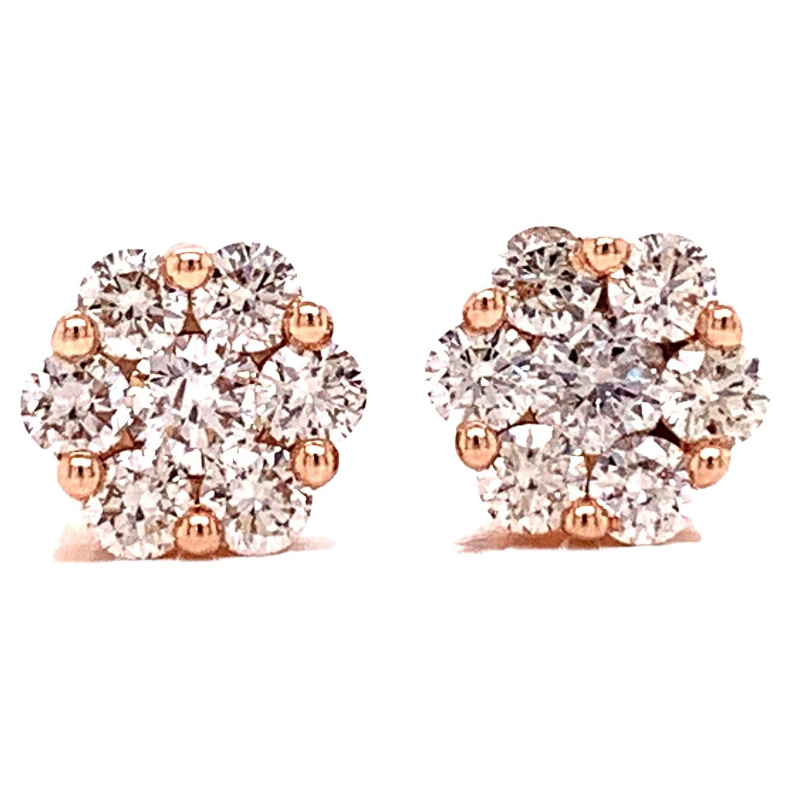 Sweet and timeless, these diamond flower cluster earrings make the perfect gift for any occasion.  With .75 cttw, and a total of 14 round diamonds, your ears will sparkle.  SI Clarity and I-J color with fine diamond cuts.  14 kt yellow gold. 