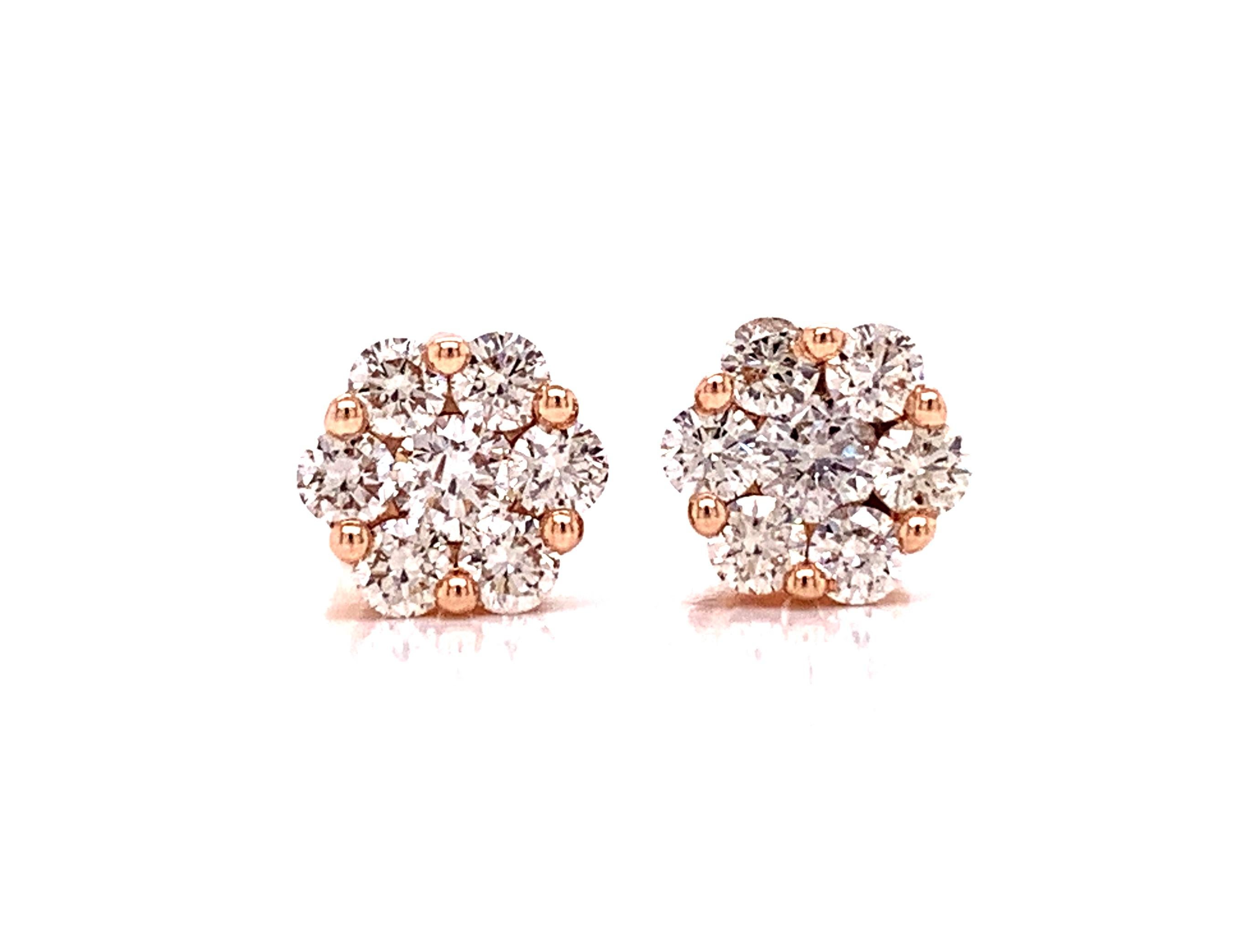 Sweet and timeless, these diamond flower cluster earrings make the perfect gift for any occasion.  With 1.0 cttw, and a total of 14 round diamonds, your ears will sparkle.  SI Clarity and I-J color with fine diamond cuts.  14 kt yellow gold. 