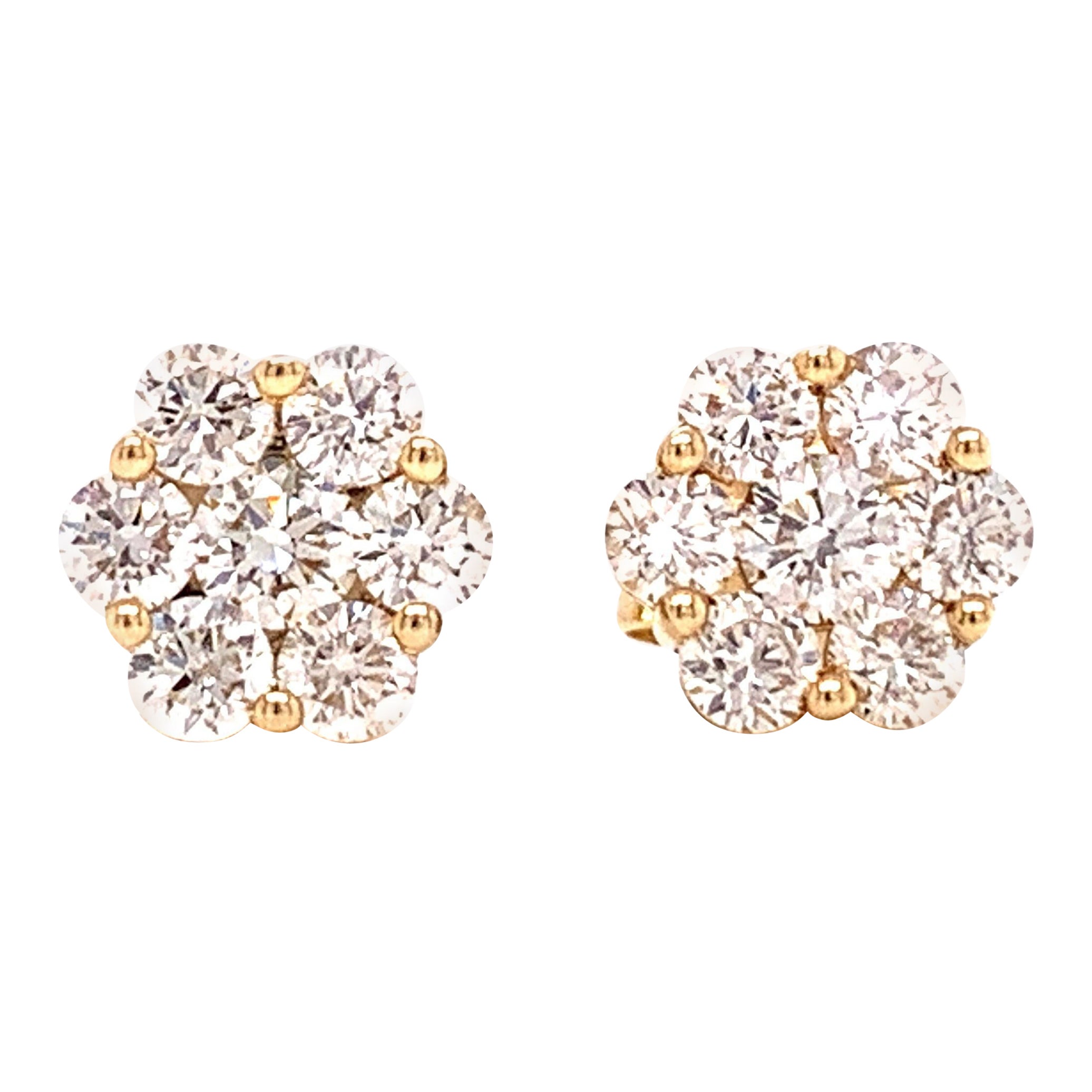 Sweet and timeless, these diamond flower cluster earrings make the perfect gift for any occasion.  With 1.0 cttw, and a total of 14 round diamonds, your ears will sparkle.  SI Clarity and I-J color with fine diamond cuts.  14 kt white gold. 
