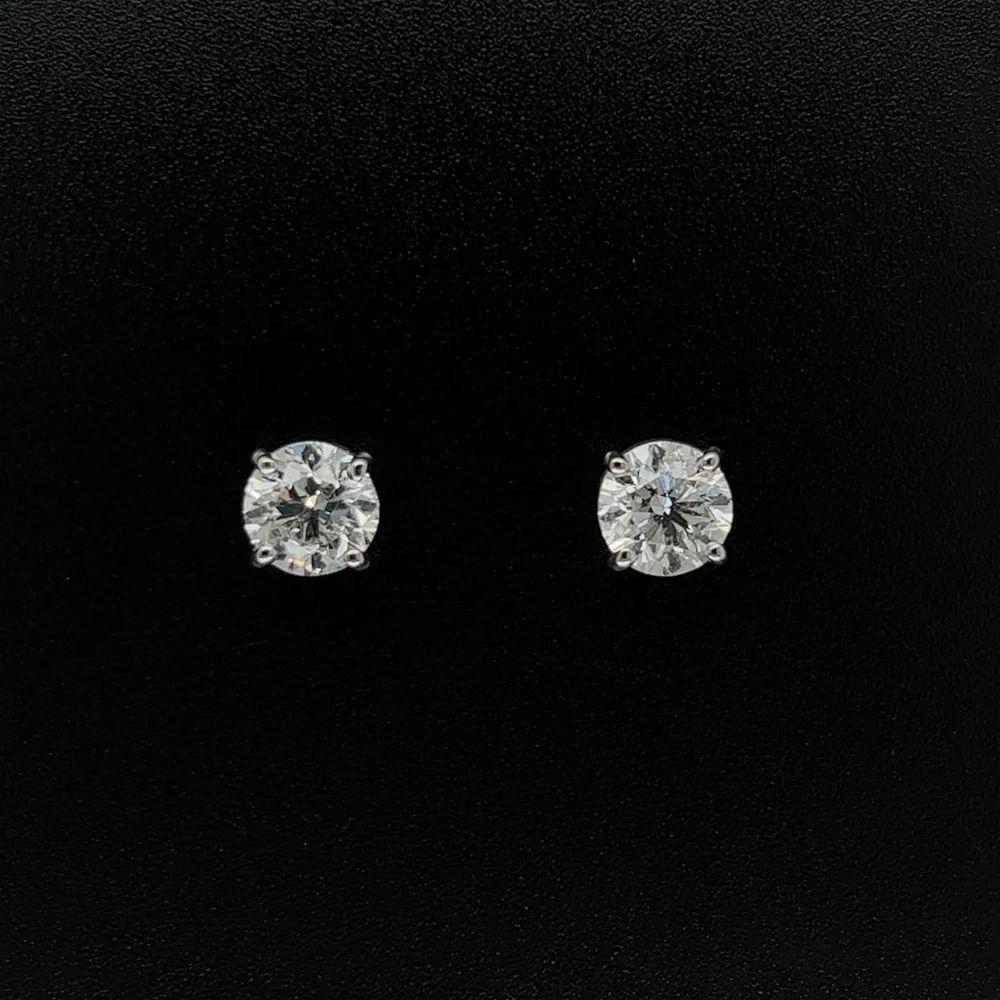 Simply Beautiful! Timeless Diamond 6.35mm Stud Earrings. Each Earring Hand set with a securely nestled Round Brilliant Cut Diamond, weighing approx. 1.00 Carat; 2.00tcw. F color – clarity SI2. Screw back system. In excellent condition, recently