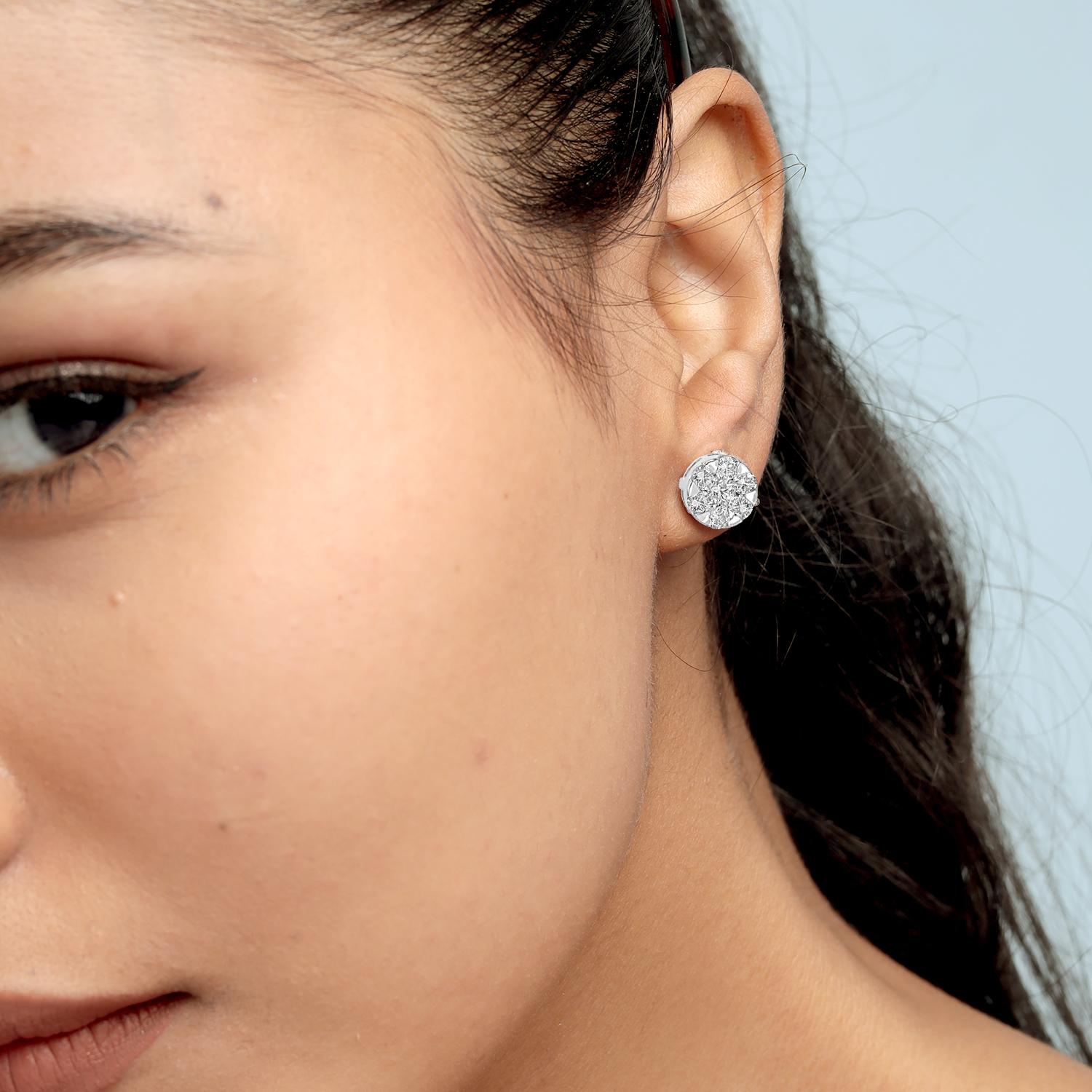 Crafted for refined simplicity, these minimal stud earrings feature a clean design set with sparkling diamonds. The compact silhouette offers a polished everyday look while retaining the elegance of fine 18k white gold and 0.82 carats of carefully