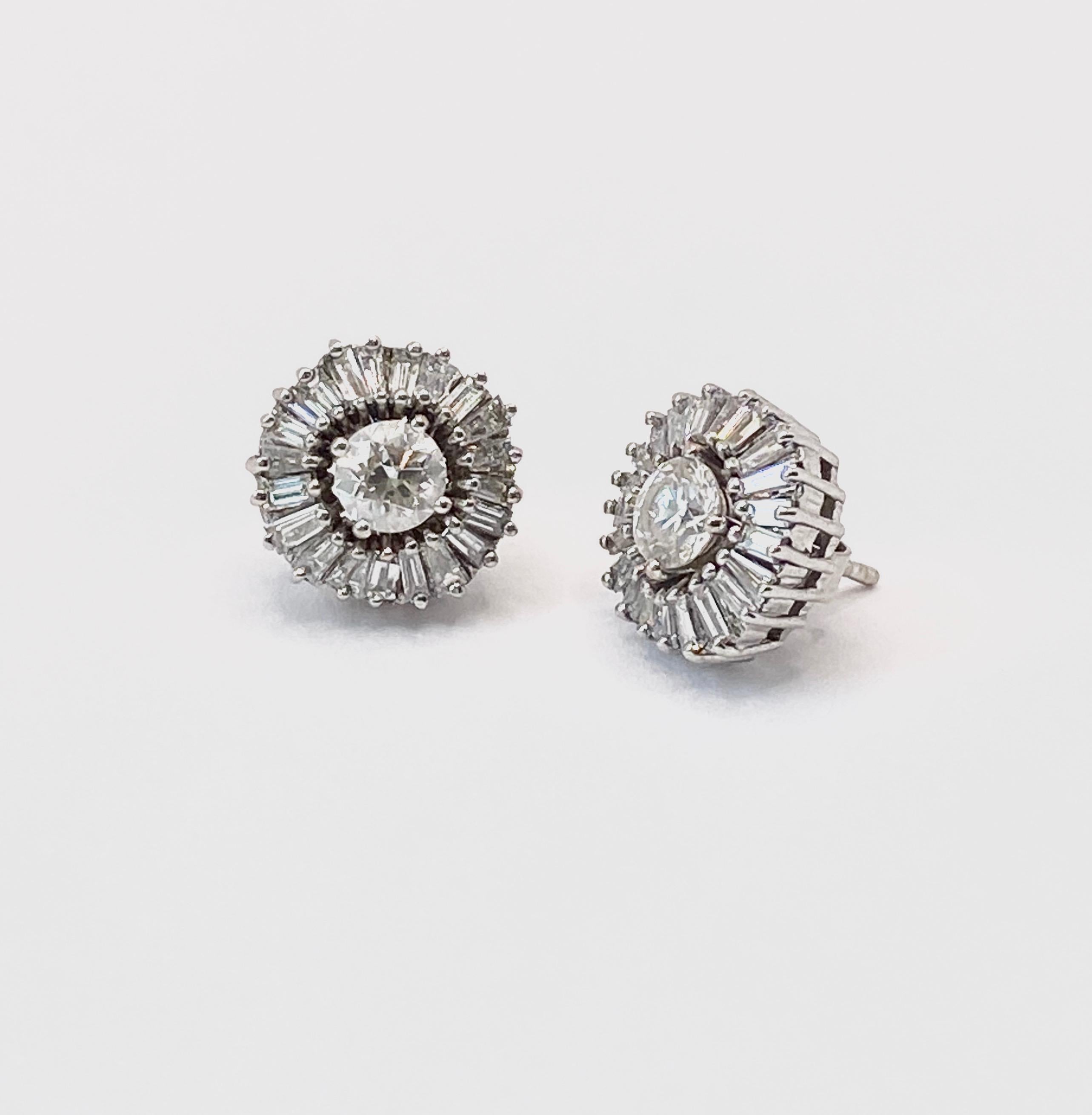 0.70 total carat diamond studs surrounded by tapered baguettes set uneven and creating a one of a kind harmonious piece. Can be created modular or as one piece. 
