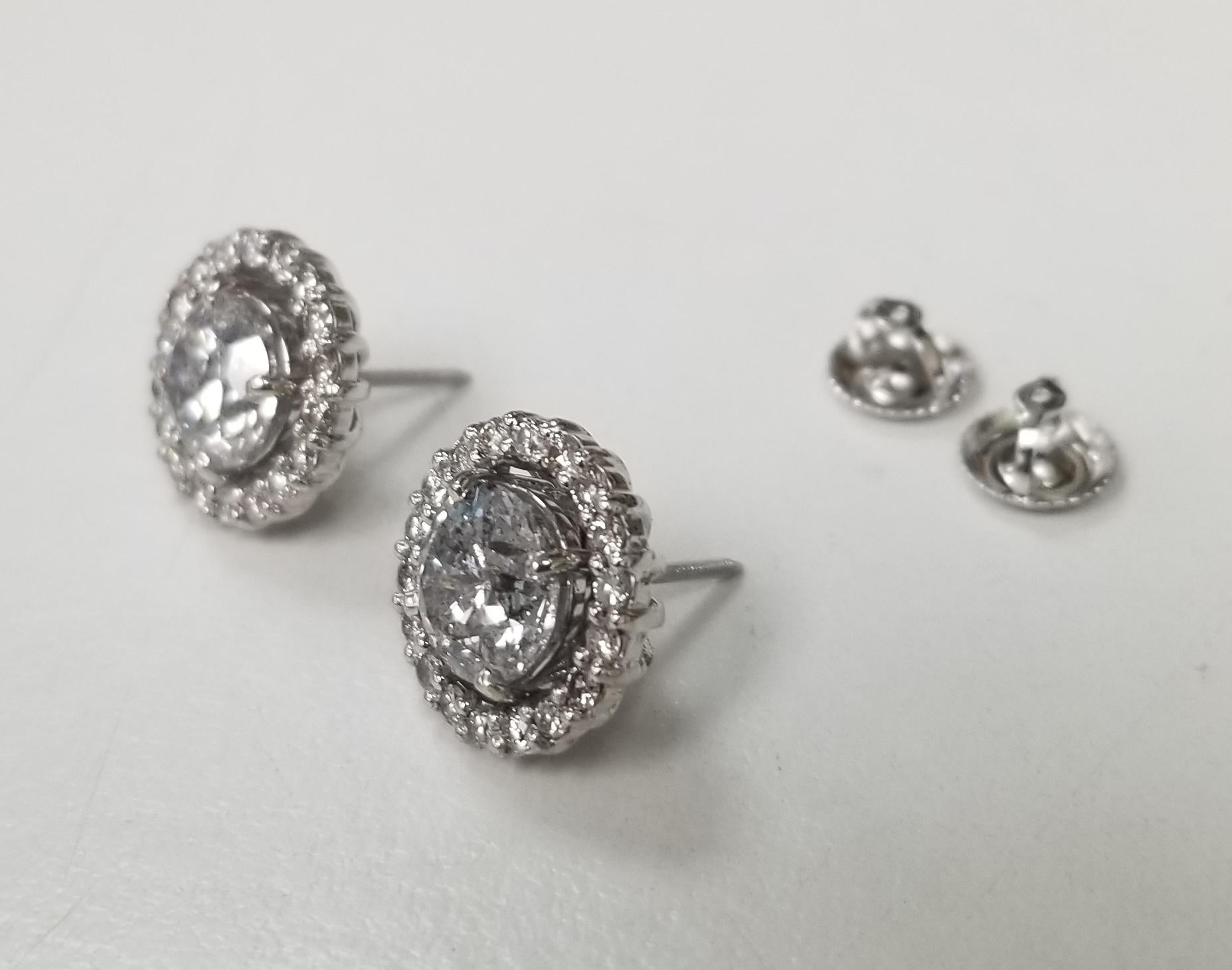 Diamond stud earrings , containing 2 brilliant cut diamonds; color 