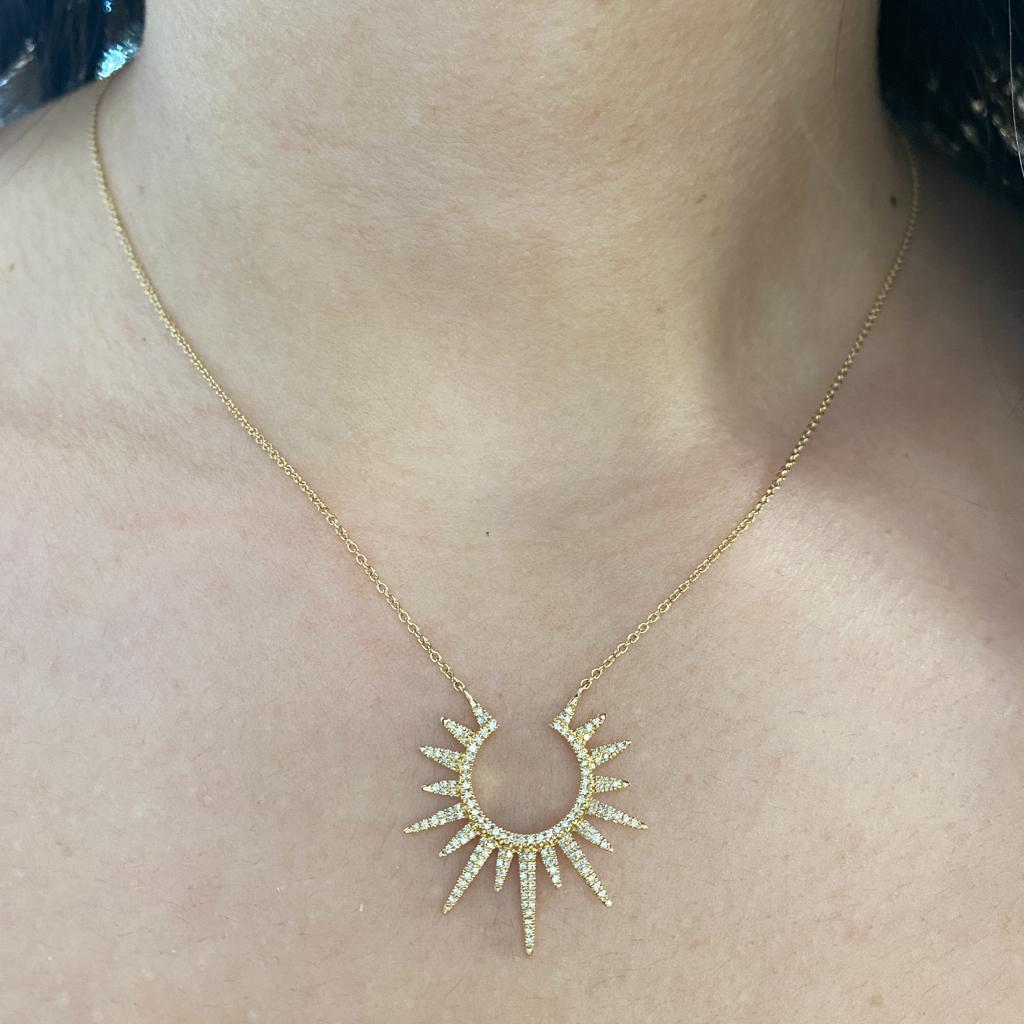 This is a gorgeous sparkling open sunburst necklace showing your sparkle and open brilliance. This beautiful necklace is made with bright and sturdy 14 karat gold and excellent quality diamonds. This can also be an open starburst and diamonds
