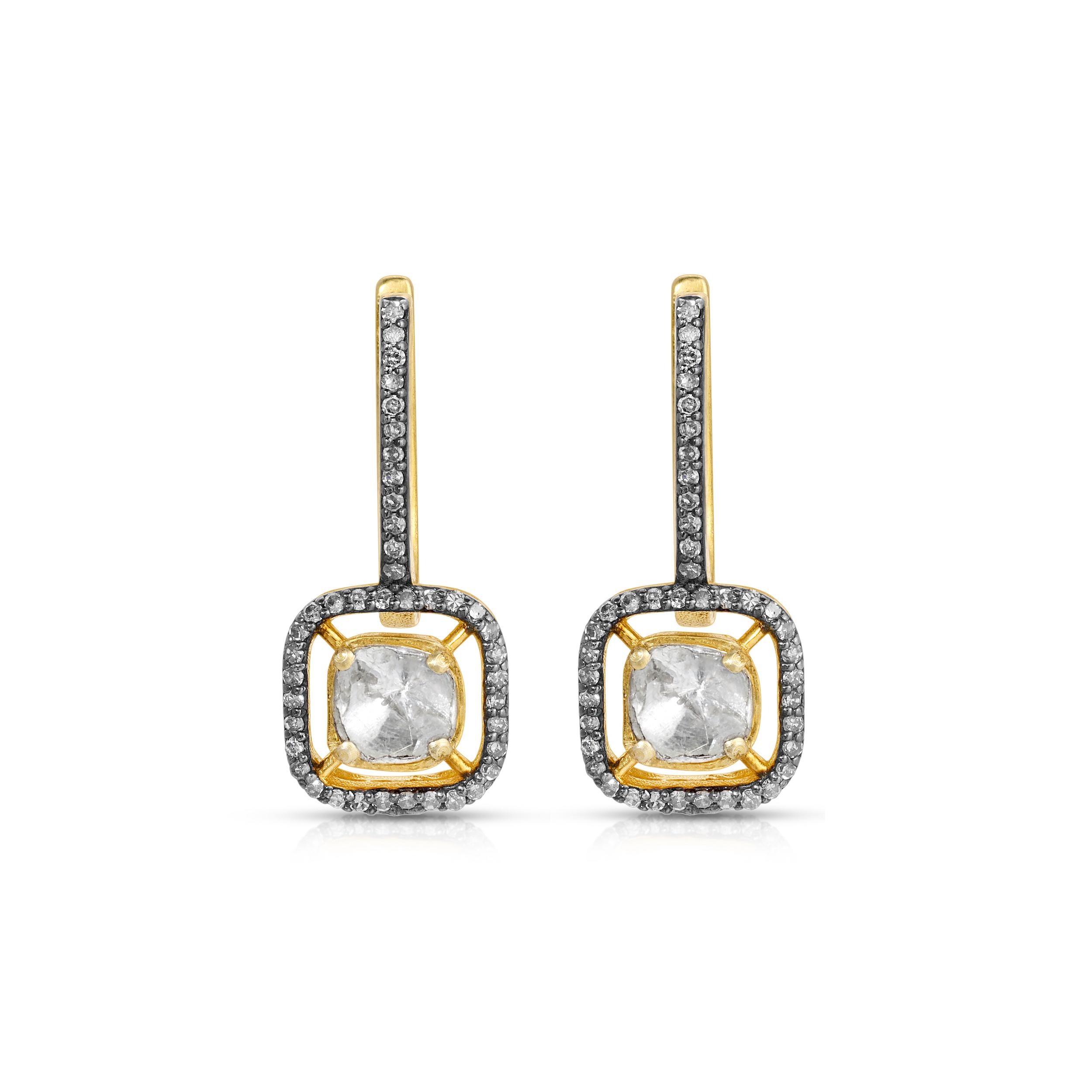 Stunning drop earrings featuring a mix of diamonds. These earrings feature fine quality Polki Diamonds in a floating Diamond set blackened bezel setting suspended from blackened Diamond set hoops. These earrings are set in 18 Karat Gold overlay