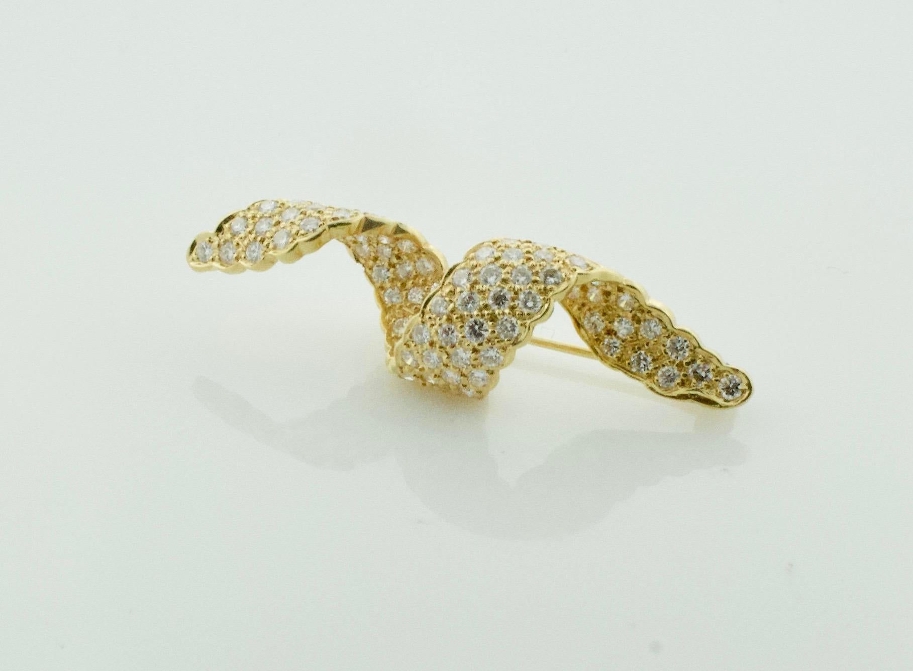 Diamond Swirl Brooch in 18k Yellow Gold 2.05 Carats Circa 1960's
A Lovely Gift 
Eighty Two Round Brilliant Cut Diamonds Weighing 2.05 Carats Approximately [GH VVS]
