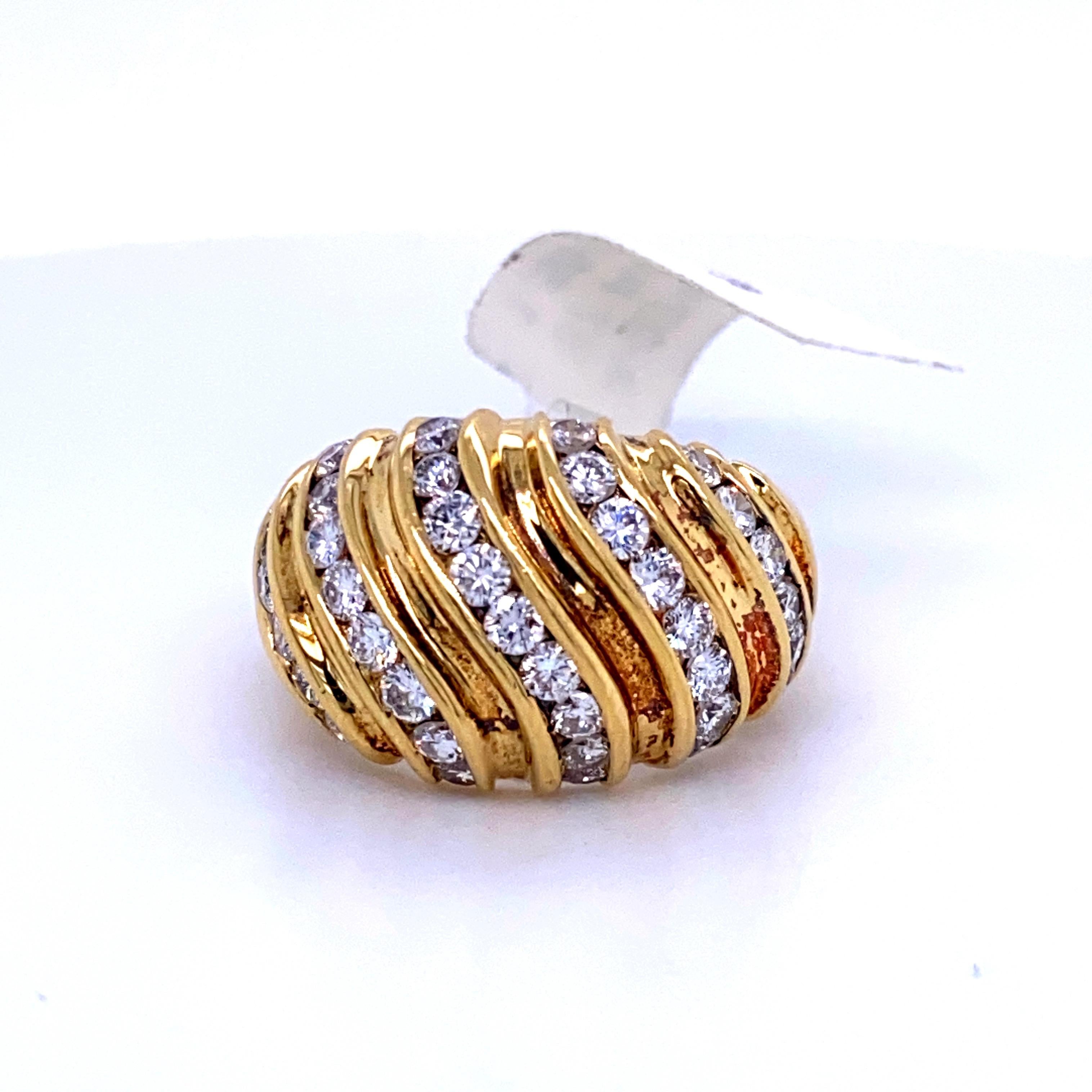18K Yellow gold dome ring featuring 37 round brilliants weighing 1.55 carats. 
Average Stone: 0.04 cts
Color G
Clarity SI

Size 6.5, 
Can be sized free of charge