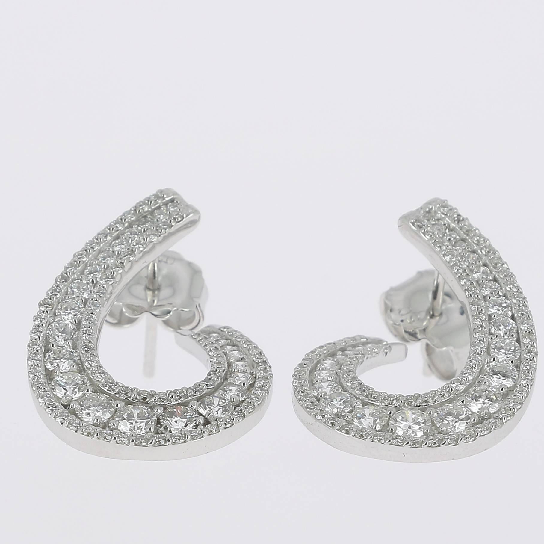 The Swirl Earrings are set with 3 Rows of White Diamonds.
The Diamond weight is 1.97 Carats.
All Diamonds are GVS qualities.
The earrings have Clip Closing security.
The Earrings are 18K White Gold.
Also available in 18 Karat Rose Gold and 18K