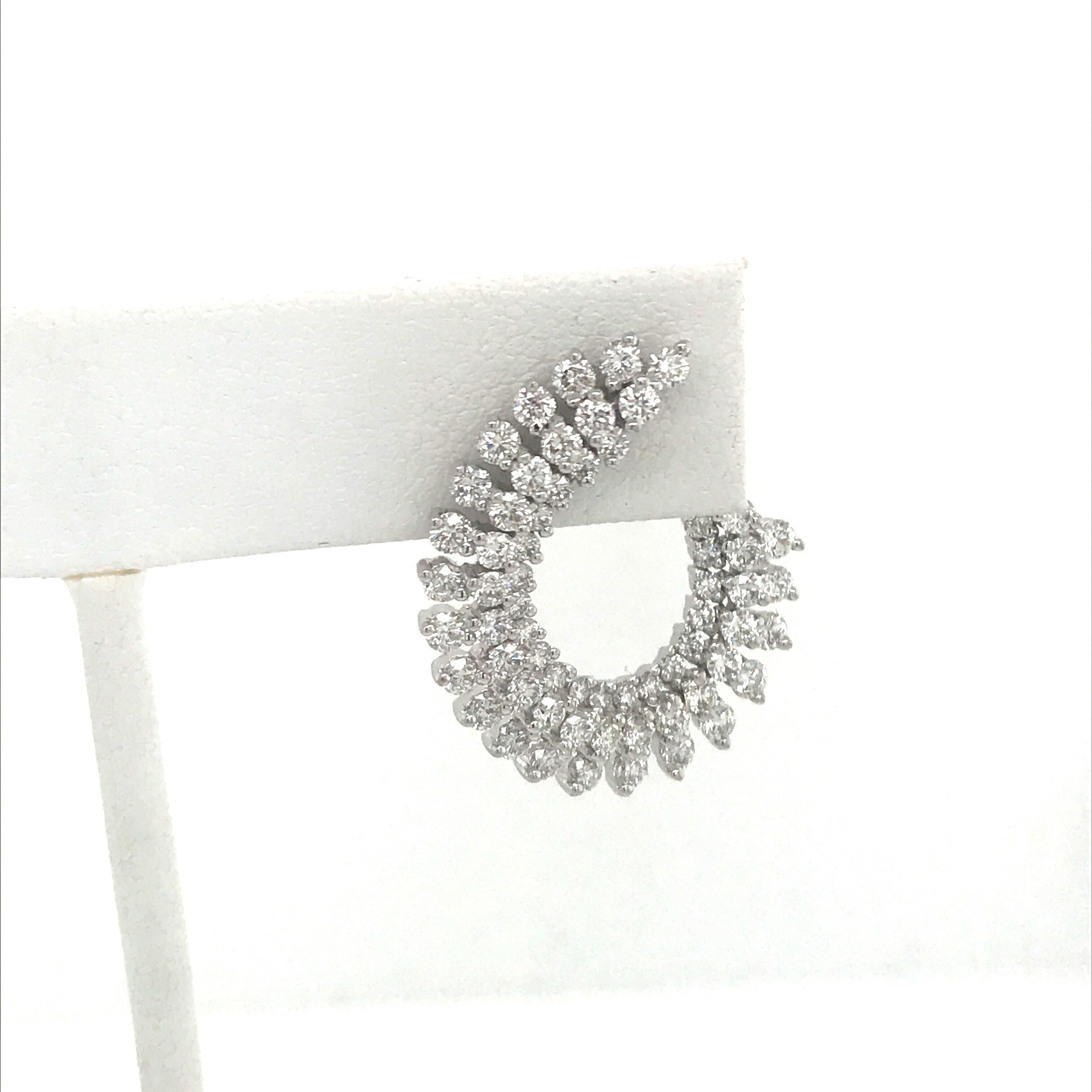 18K White gold earrings featuring 164 round brilliants weighing 3.87 carats. 
Color G-H
Clarity SI