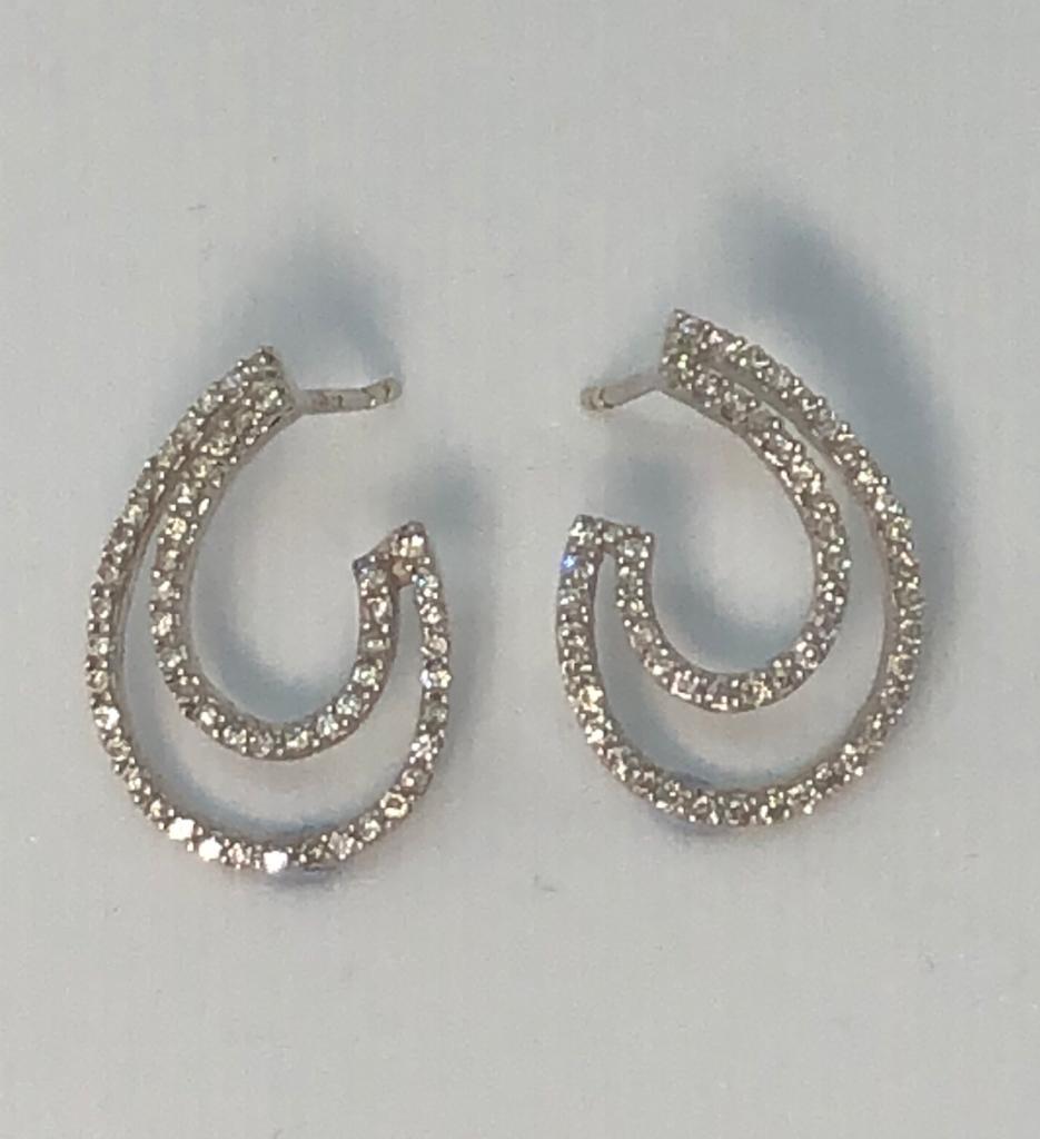 Diamond Swirl Earrings in 18kt White Gold. Post and butterfly fittings.
Earrings measure 15 mm long x 6 mm at widest point. 
Light and lively an easy addition to your daily look.