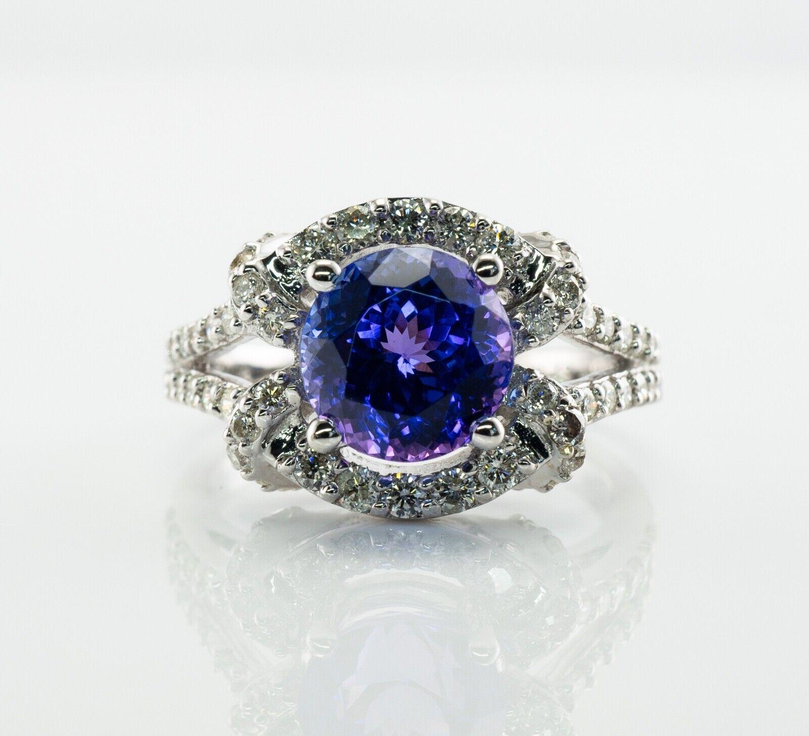 Diamond Tanzanite Ring 18K White Gold by Galaxy

This gorgeous estate ring is finely crafted in solid 18K White gold and set with genuine Earth mined Tanzanite and Diamonds. It is also hallmarked 
