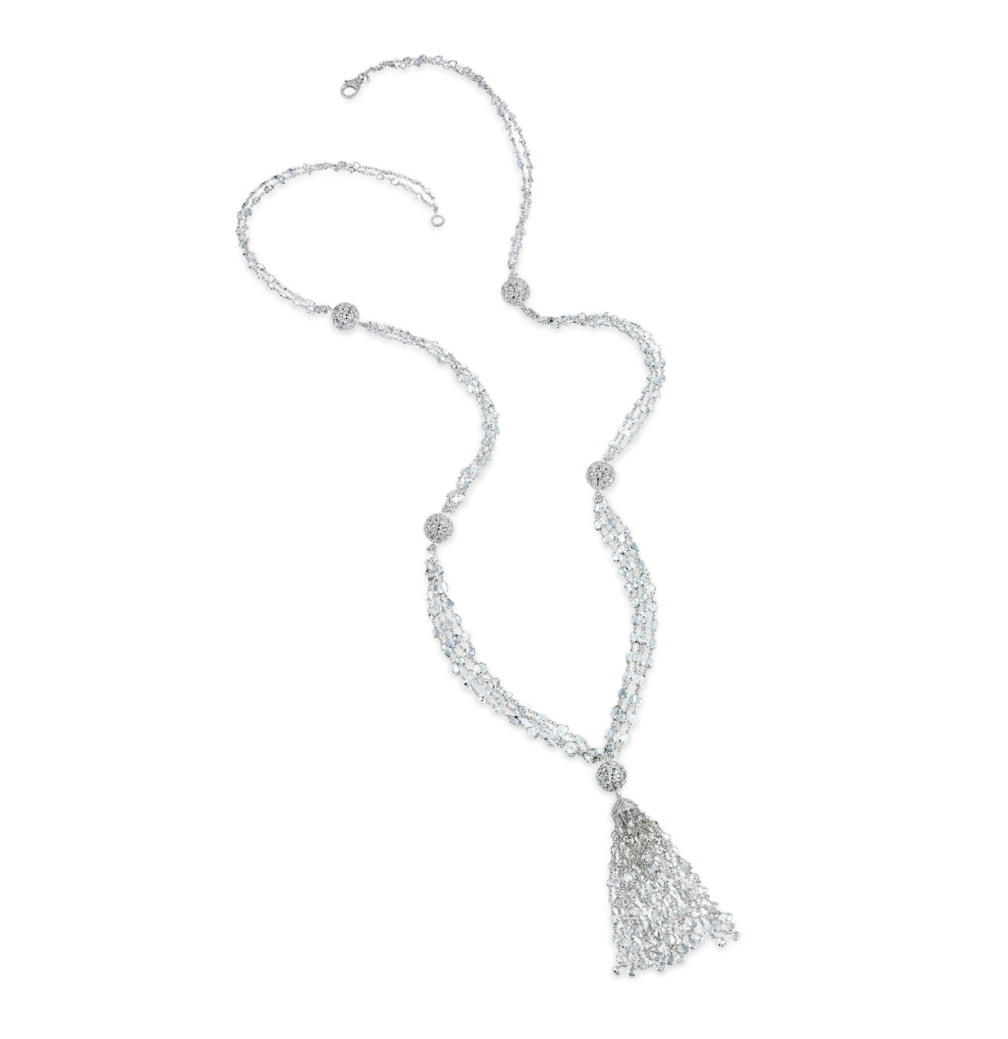 This exquisite diamond tassel necklace, with a total carat weight of 53.94, is a masterpiece of timeless elegance and craftsmanship. It features a meticulously designed chain of mixed shape rose cut diamonds, punctuated by five spheres of diamonds,