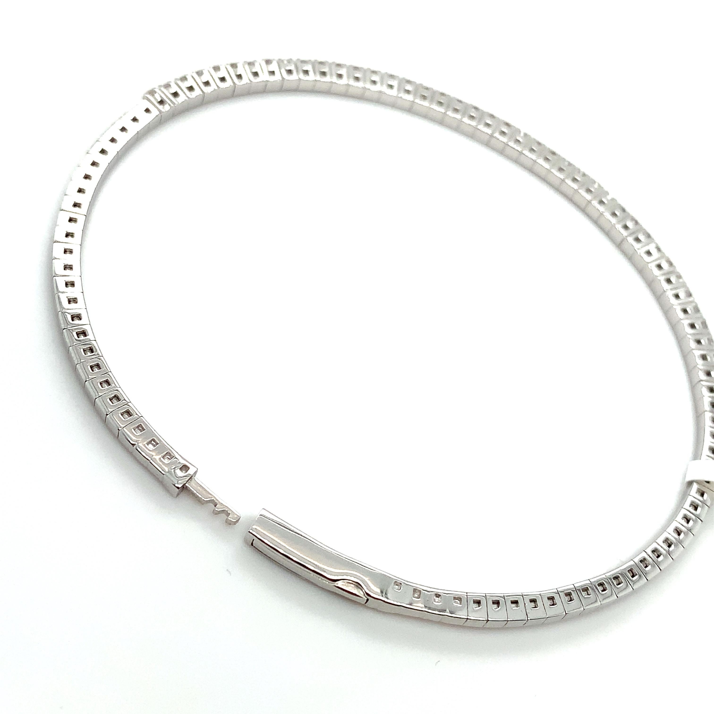 Tennis diamond bangle bracelet 18ct white gold
Composed of round brilliant diamonds total weighing 2.05ct F in colour VS1 clarity
The bracelet is hallmarked
Modern tennis diamond eternity bangle bracelet, diamond pave setting thine and fine round