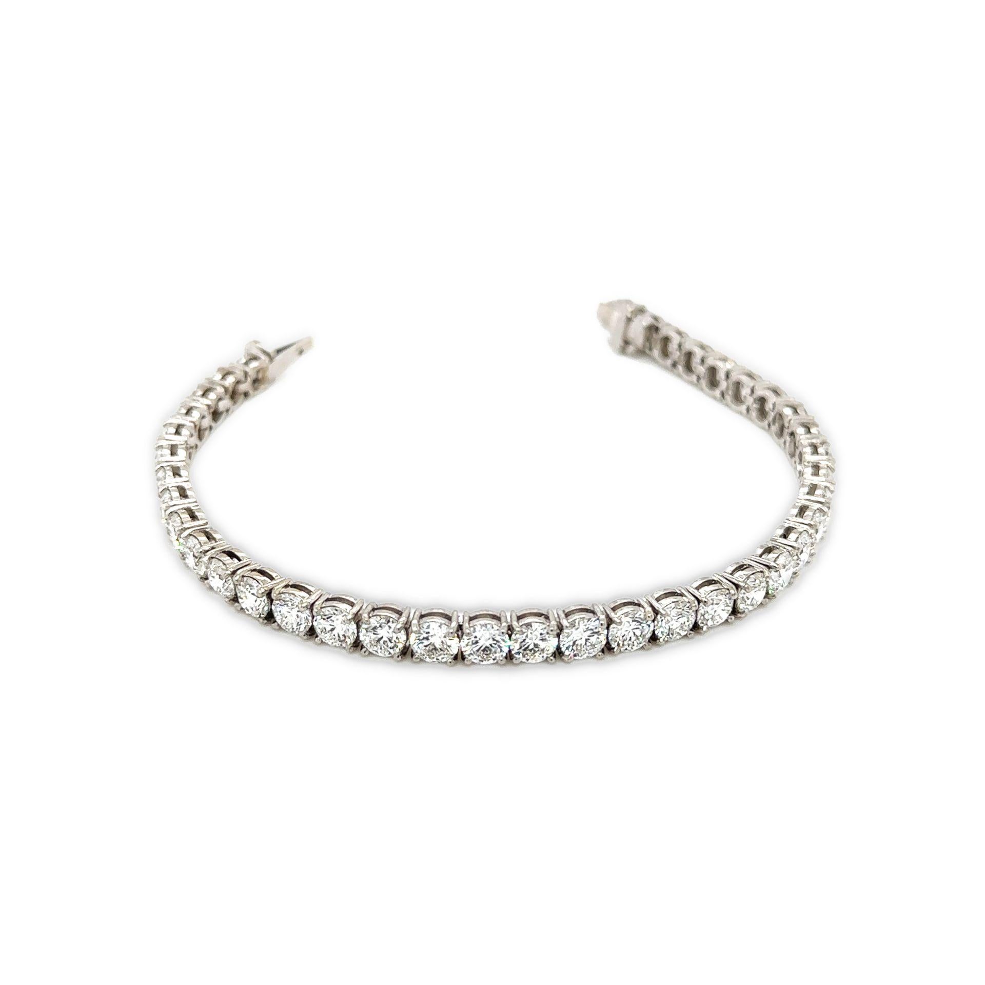 Diamond Tennis Bracelet 11.84 Total Carat Weight 18K White Gold

With Round Diamonds, 0.30-0.35 Carats Each 

Diamonds are DE in Color and VS2/SI2 in Clarity

With GIA Certificates

Total Carat Weight is 11.84 Carats 

4-Prong Setting

Set in 18