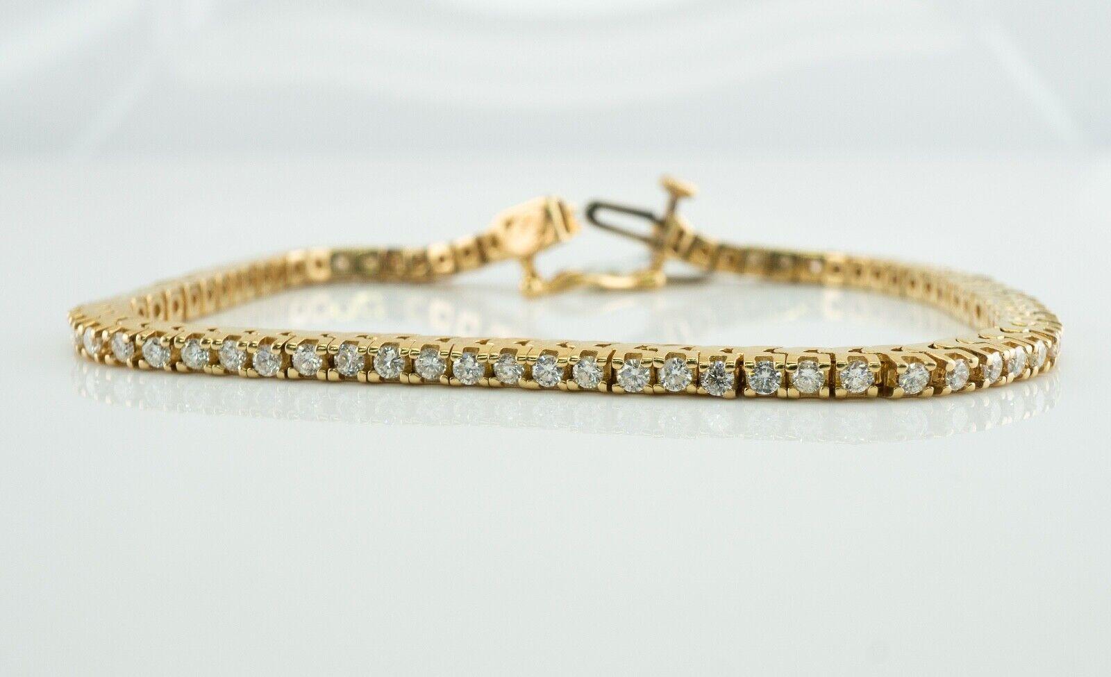 This amazing estate tennis bracelet was a part of an auction parcel. It is crafted in solid 14K Yellow gold and set with white and fiery round brilliant cut diamonds. There are 72 diamonds. The diamonds range from SI1 to SI2 clarity and H color. The