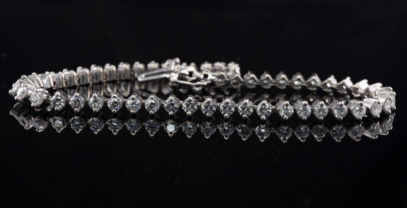 This amazing estate tennis bracelet is crafted in solid 14K White gold and set with white and fiery round brilliant cut diamonds. There are 55 diamonds of SI1 clarity and H color totaling 3.00 carats. The width of the bracelet is 3.8mm and it is