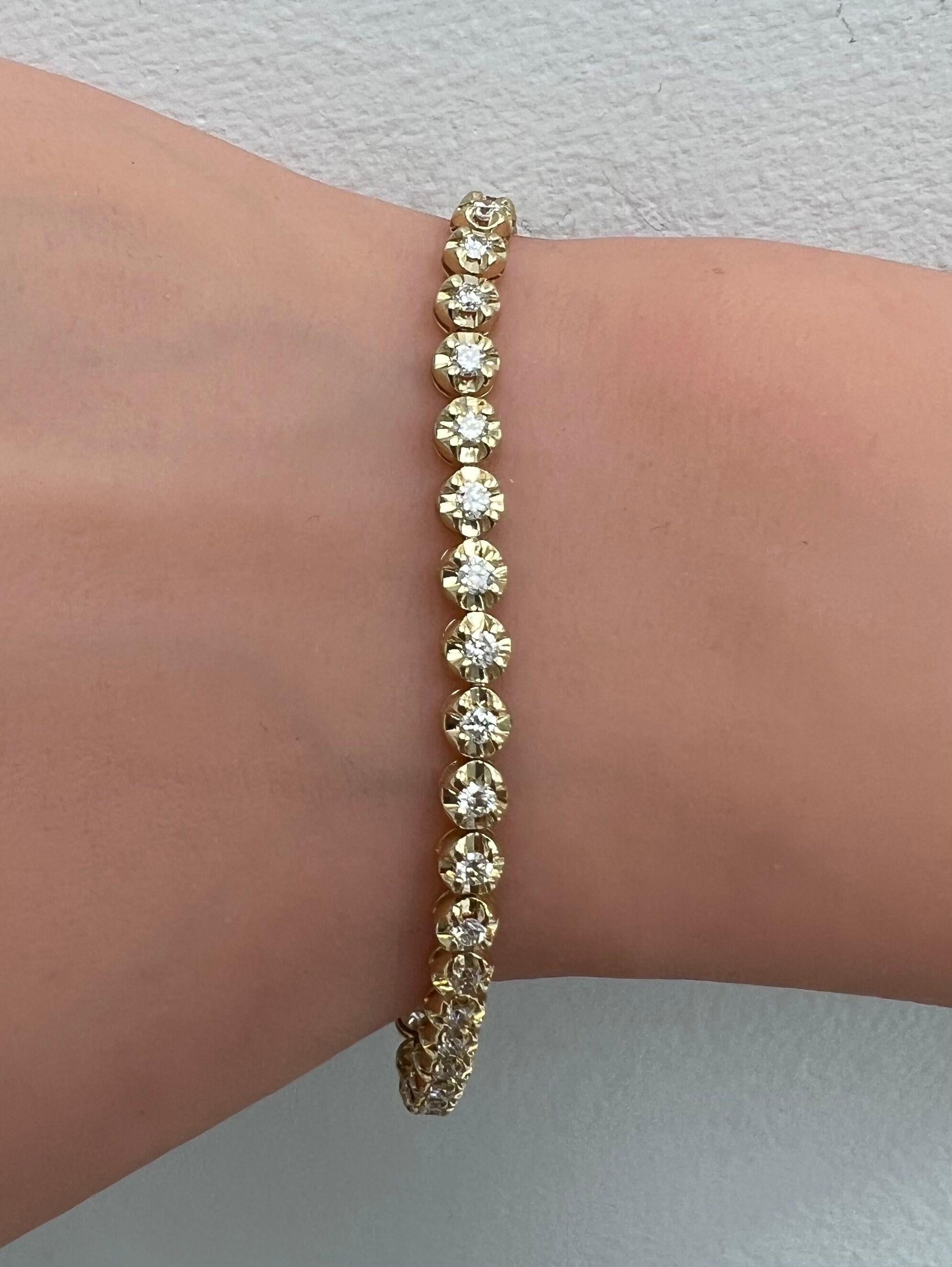Diamond Tennis Bracelet with Innovative Illusion Setting
This 2.00 Carats diamond bracelet has a look of a 10.00 carats, due to the new and innovative illusion setting.
Natural Full Brilliant Cut Diamonds
14k Yellow Gold
Number of Diamonds: 39
Total