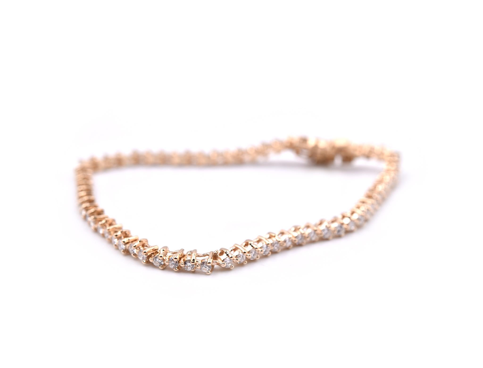 Designer: custom designed
Material: 14k yellow gold
Diamonds: 66 round brilliant cut= 1.98cttw
Color: G
Clarity: VS
Dimensions: bracelet is 7” inch long and it is approximately 3.27mm wide
Weight: 8.64 grams
