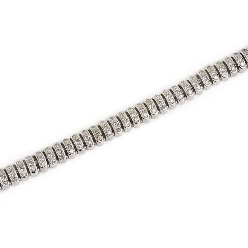 An 18k white gold diamond set bracelet. The bracelet is made up of 56 round brilliant cut diamond pave set links. The oval links have a total of 168 diamonds, totalling 2.86ct, the daimonds are H/I colour and VS2 clarity. The length of the bracelet