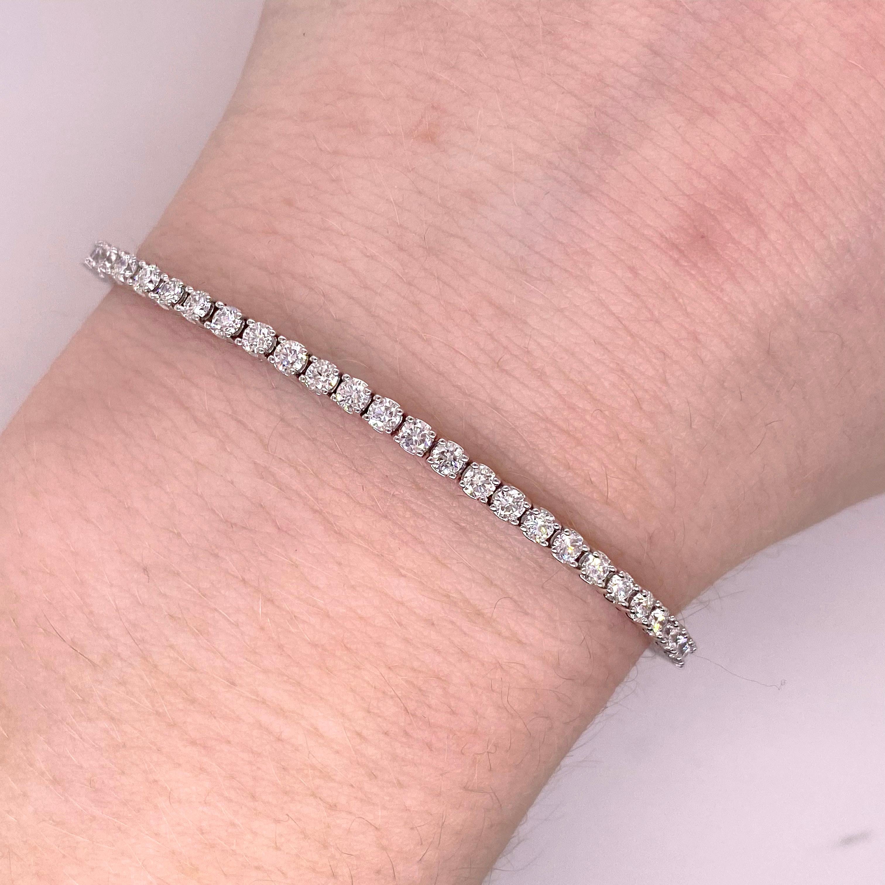 The details for this gorgeous bracelet are listed below:
Bracelet Type: Tennis
Metal Quality: 14 Karat White Gold
Diamond Number: 71
Length: 7 inches
Width: 2.53 millimeters
Clasp: Hidden with an Underneath Safety Latch
Diamond Shape: Round
Total