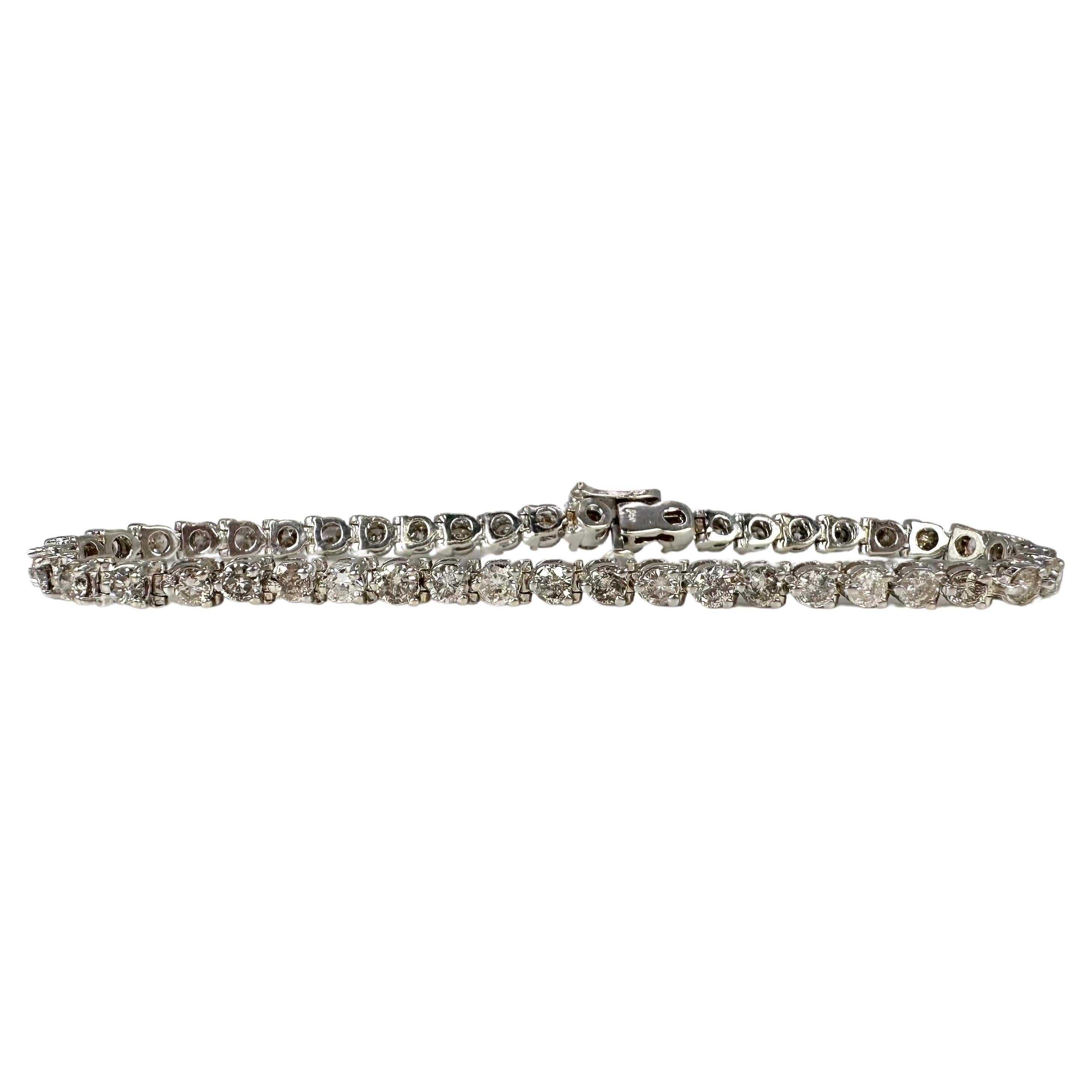 Beautiful classical diamond bracelet in 14KT white gold with 3 claw prong setting.

GOLD: 14KT gold
NATURAL DIAMOND(S)
Clarity/Color: SI-I/K-L-M
Carat:4.50ct
Cut:Round Brilliant
Grams:11.08
Item#: 170-00087MTTT

WHAT YOU GET AT STAMPAR