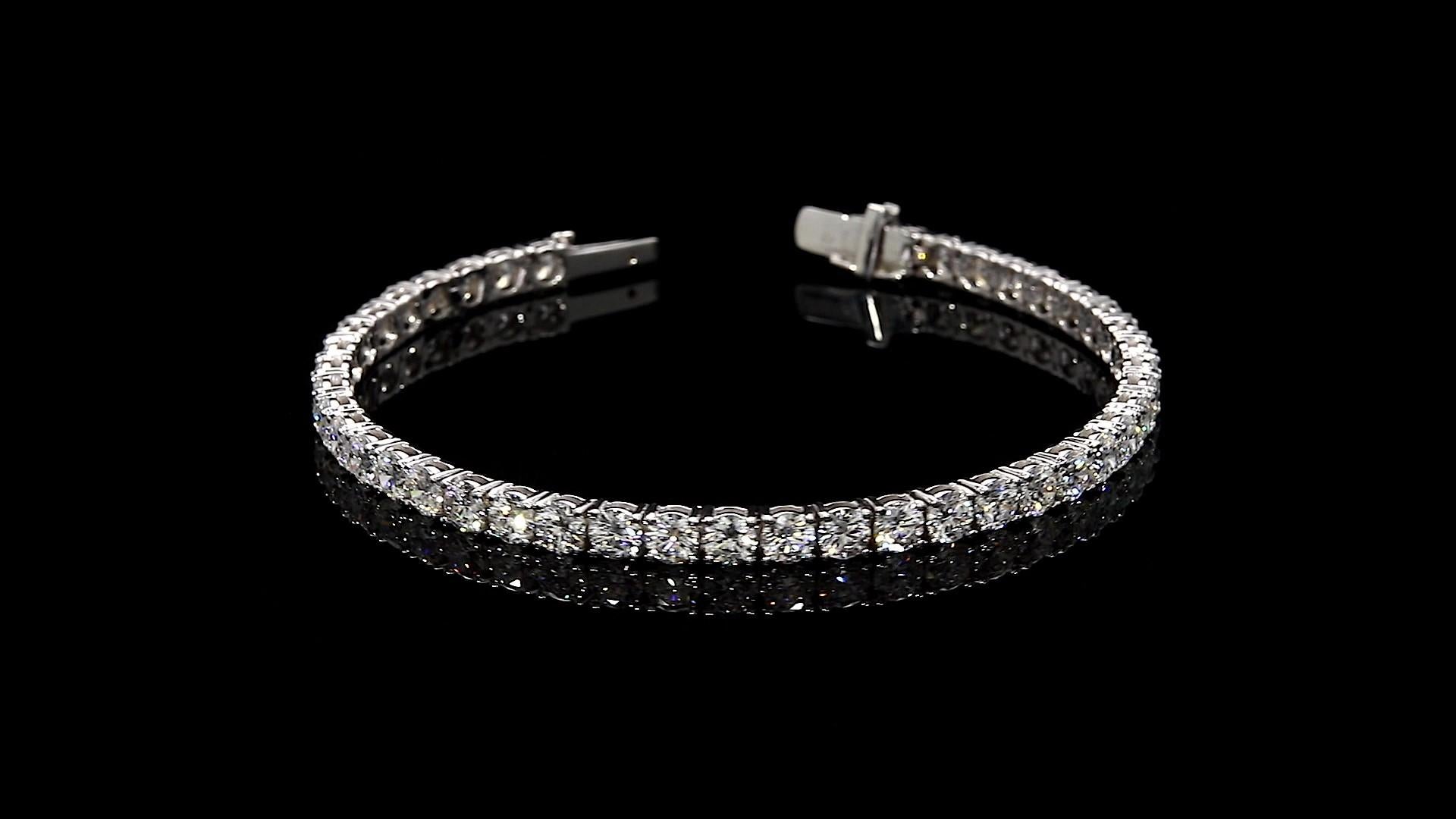 Diamond Tennis Bracelet 4.93 Total Carat Weight 18K White Gold

With Round Diamonds, 0.08 Carats Each 

Diamonds are DEF in Color and VS2 in Clarity

Total Carat Weight is 4.39 Carats 

4-Prong Setting

Length: 7.0 inches

Set in 18 Karat White