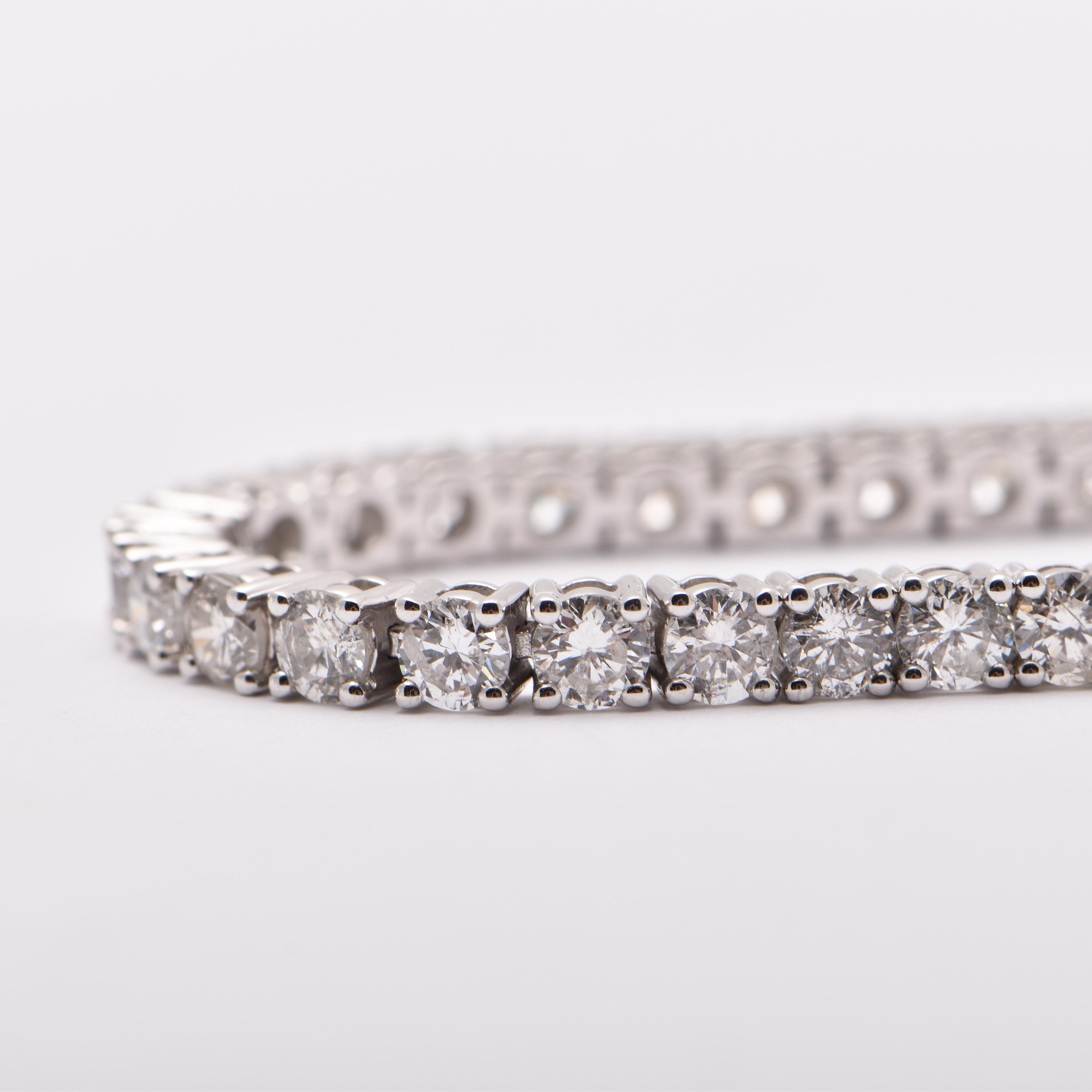Diamond tennis bracelet; featuring 50 round brilliant cut diamonds totalling 6.75 Carats, set in 18ct white gold (total 11.96 grams)   

FREE express postage usually 3-4 days Sydney to New York  
FREE international insurance 
by Cartmer Jewellery,