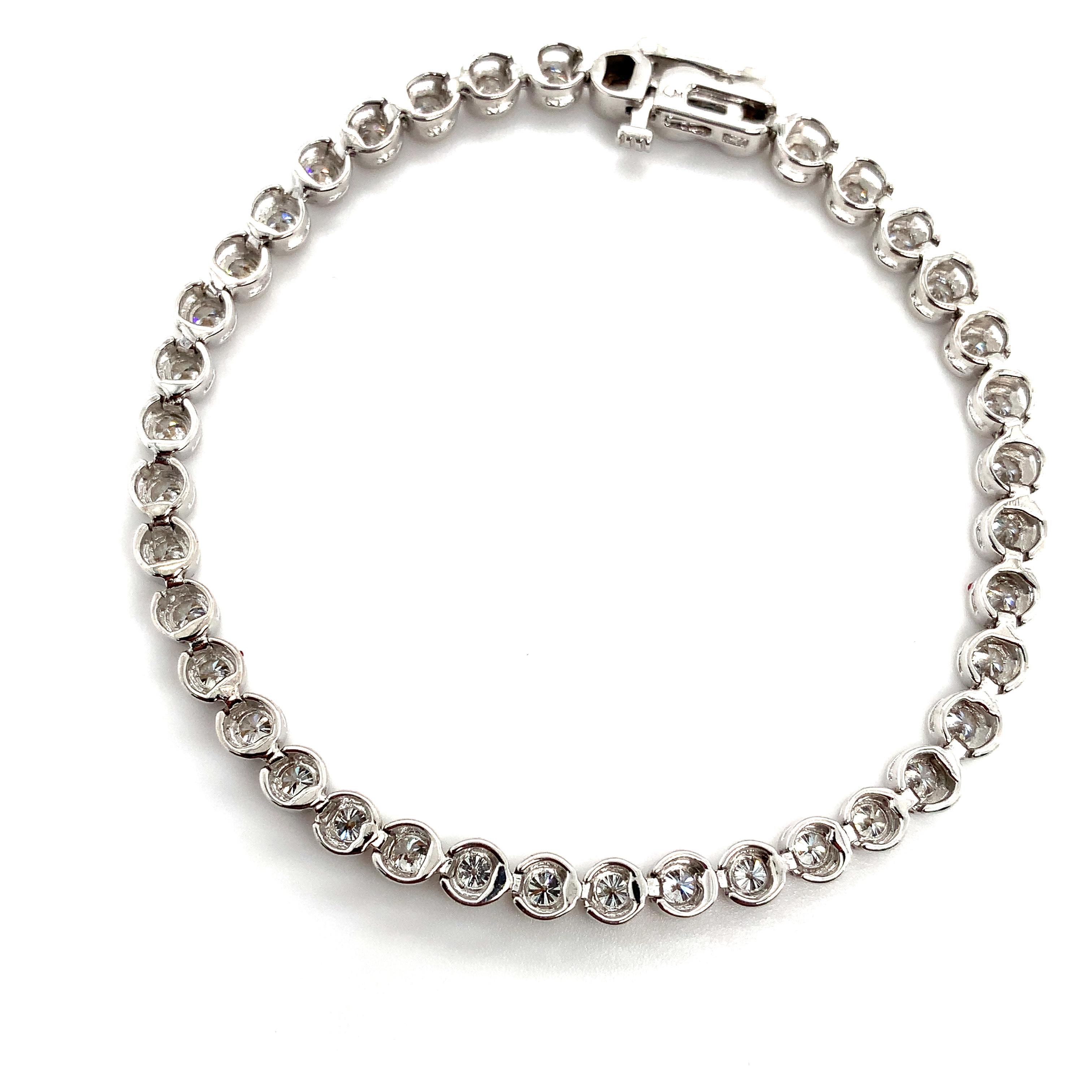 Diamond tennis bracelet bezel rubover 18k white gold For Sale 1