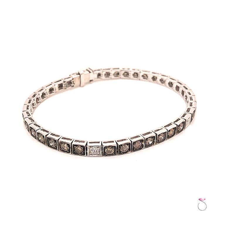 Gorgeous Diamond tennis bracelet with chocolate and white diamonds in 18k white gold. This beautiful bracelet features 35 round brillian cut fancy chocolate diamonds and 5 round brilliant diamonds. The diamonds are set in a straight line with each 7