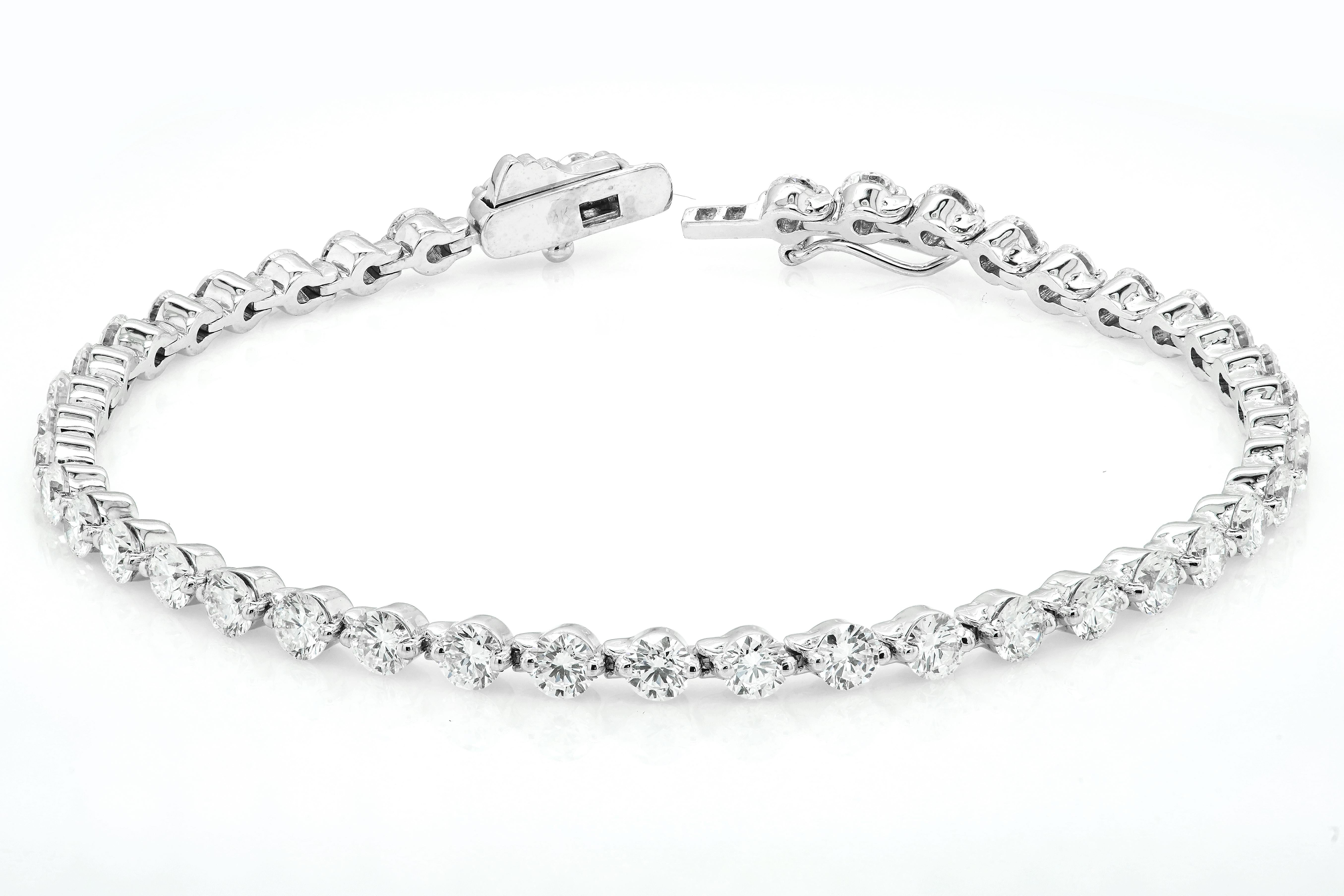 Diamond Tennis Bracelet consisting of 43 natural diamonds set in 14K White Gold 

3mm Round brilliant Cut Diamonds, 4.77 carats  - G-H Colour, SI Quality Grade 



*Free Delivery

