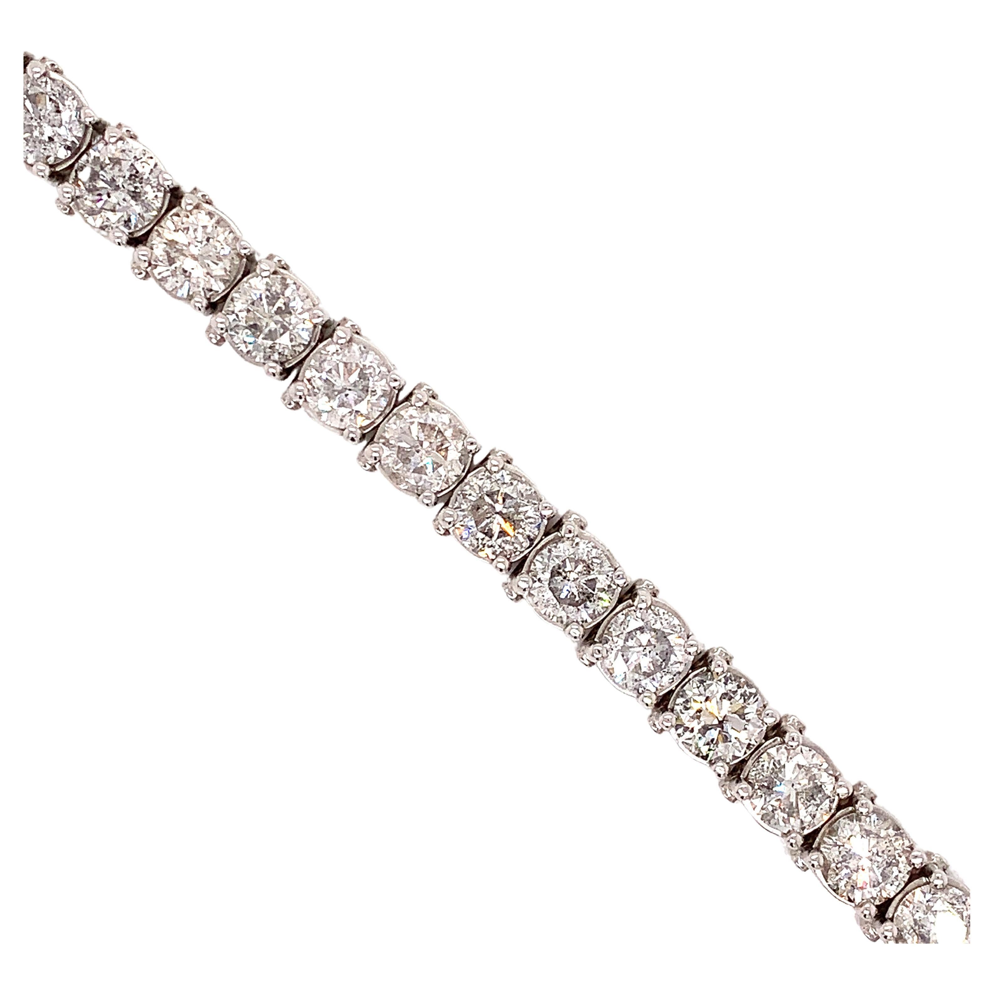 With EACH diamond approximately 1.14 carat, this is a spectacular sparkling diamond tennis bracelet! Twenty six round diamonds make up 29.75 cttw.  The diamonds are I1-I2color and I-J in color.  They are set in a classic 14 kt white gold four prong