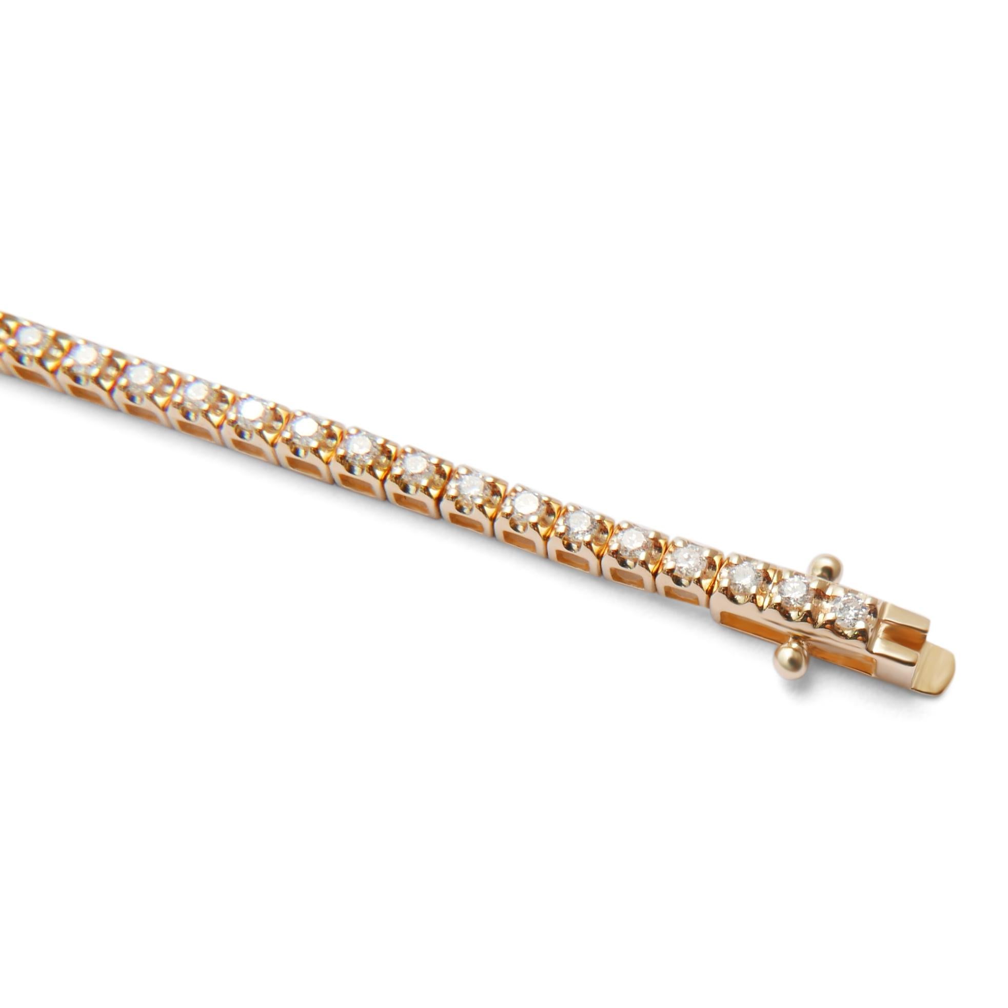 This elegant diamond tennis bracelet features 81 sparkling diamonds set in 18-karat yellow gold. A timeless classic, this piece transitions easily from day to night. The diamonds are  set into a 4-prong setting for maximum sparkle.  Bracelet is 7.25