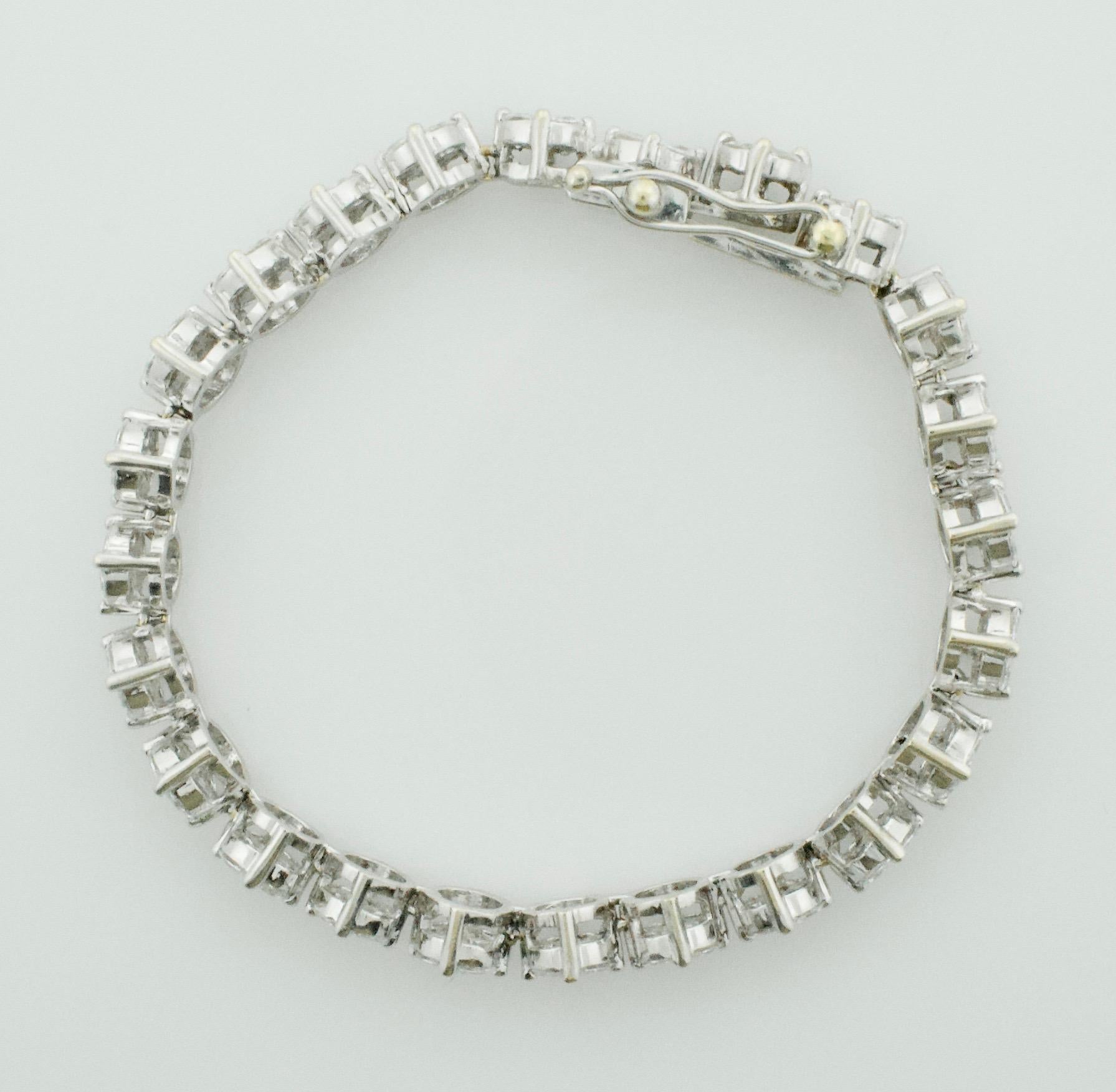 Diamond Tennis Bracelet in Platinum and White Gold 7.20 carats Petite Size
Each Link is Compose of Five Fancy Shaped Diamonds.  (Four Marquises and One Princess Cut) Each Link is 6.4 mm.  This Gives The Look of a One Carat Diamond.
Twenty Four