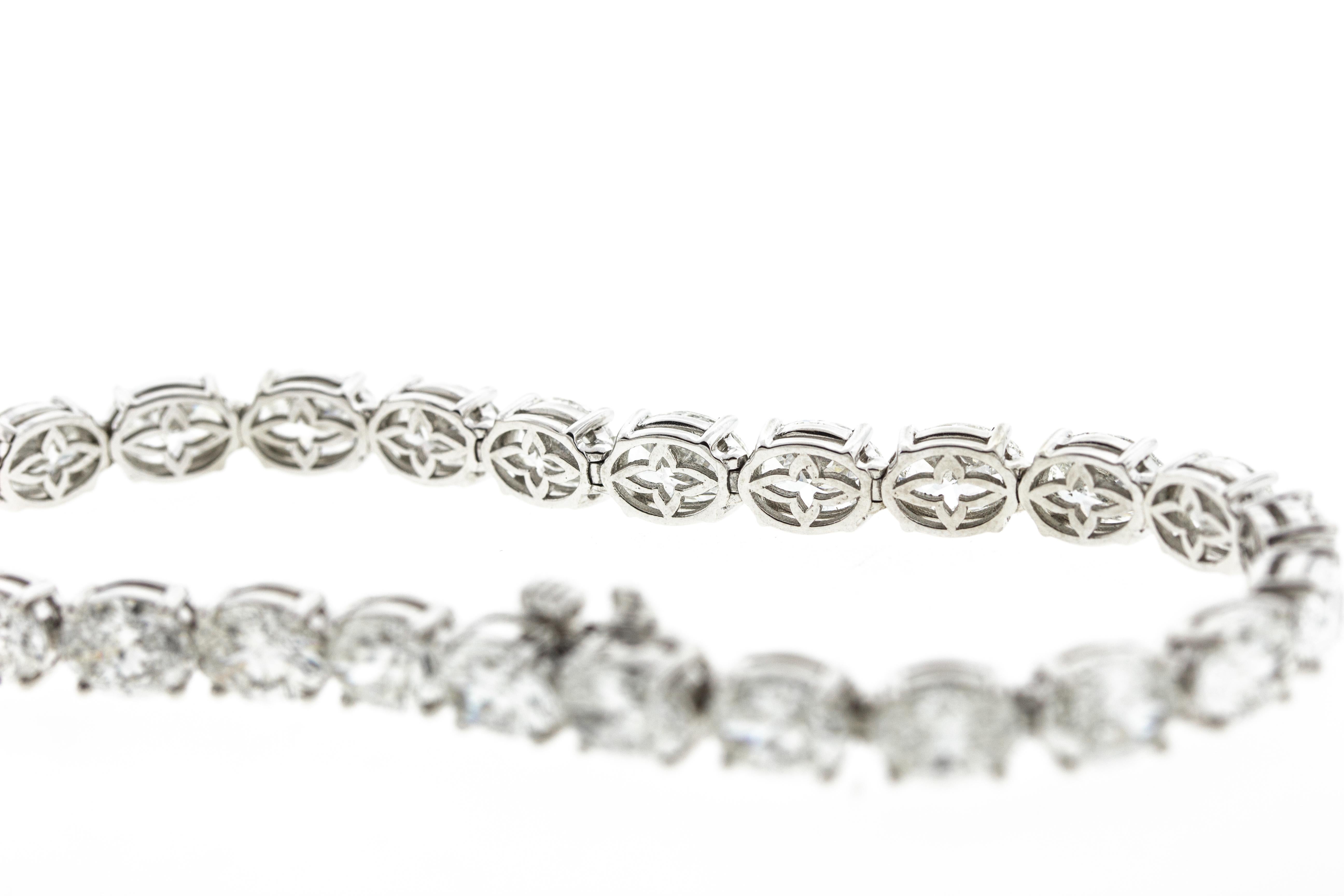 This diamond tennis bracelet is made in platinum and features 25 oval diamonds for a total carat weight of 7.97 carats. 