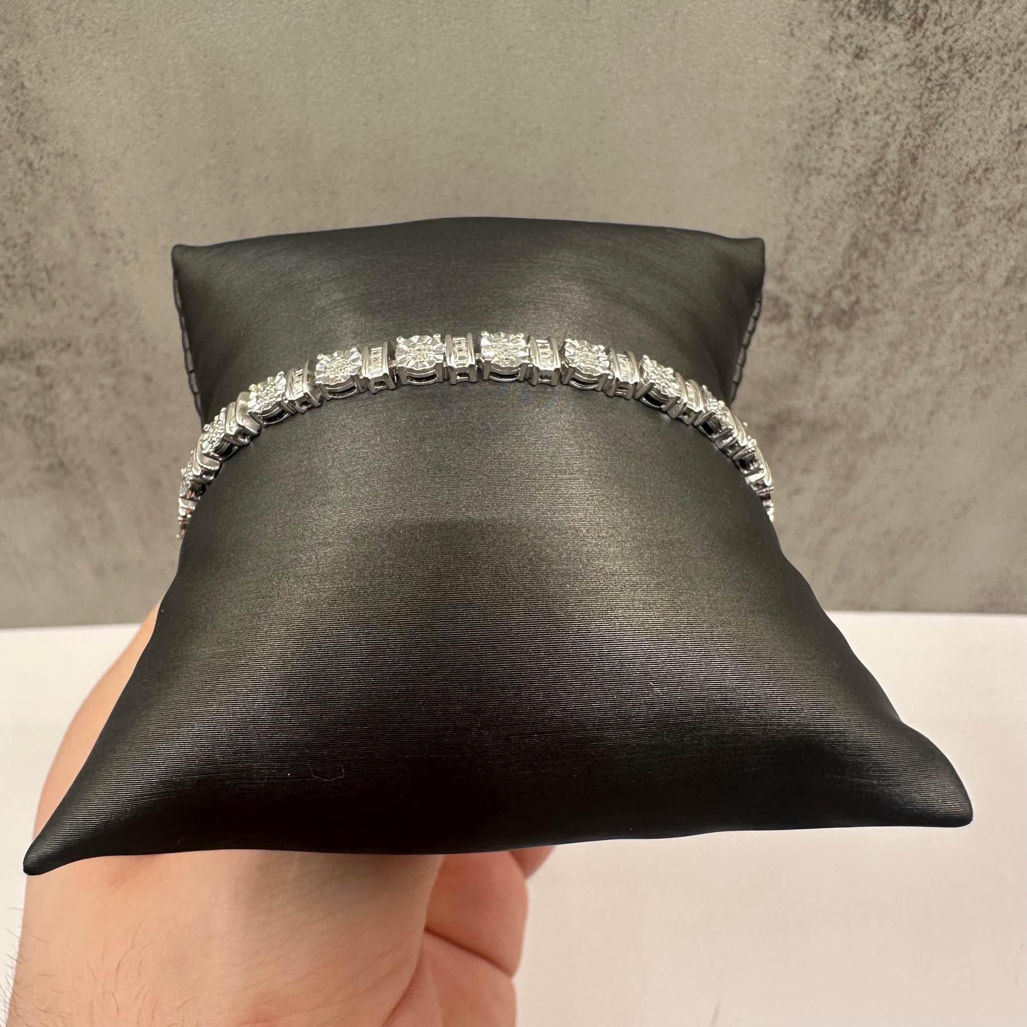 This stunning Diamond Tennis Bracelet in sterling silver features 0.25ctw of natural I color, I clarity diamonds, offering a subtle yet brilliant sparkle. With a 7.625-inch length and 5mm width, it fits comfortably on most wrists while making a bold