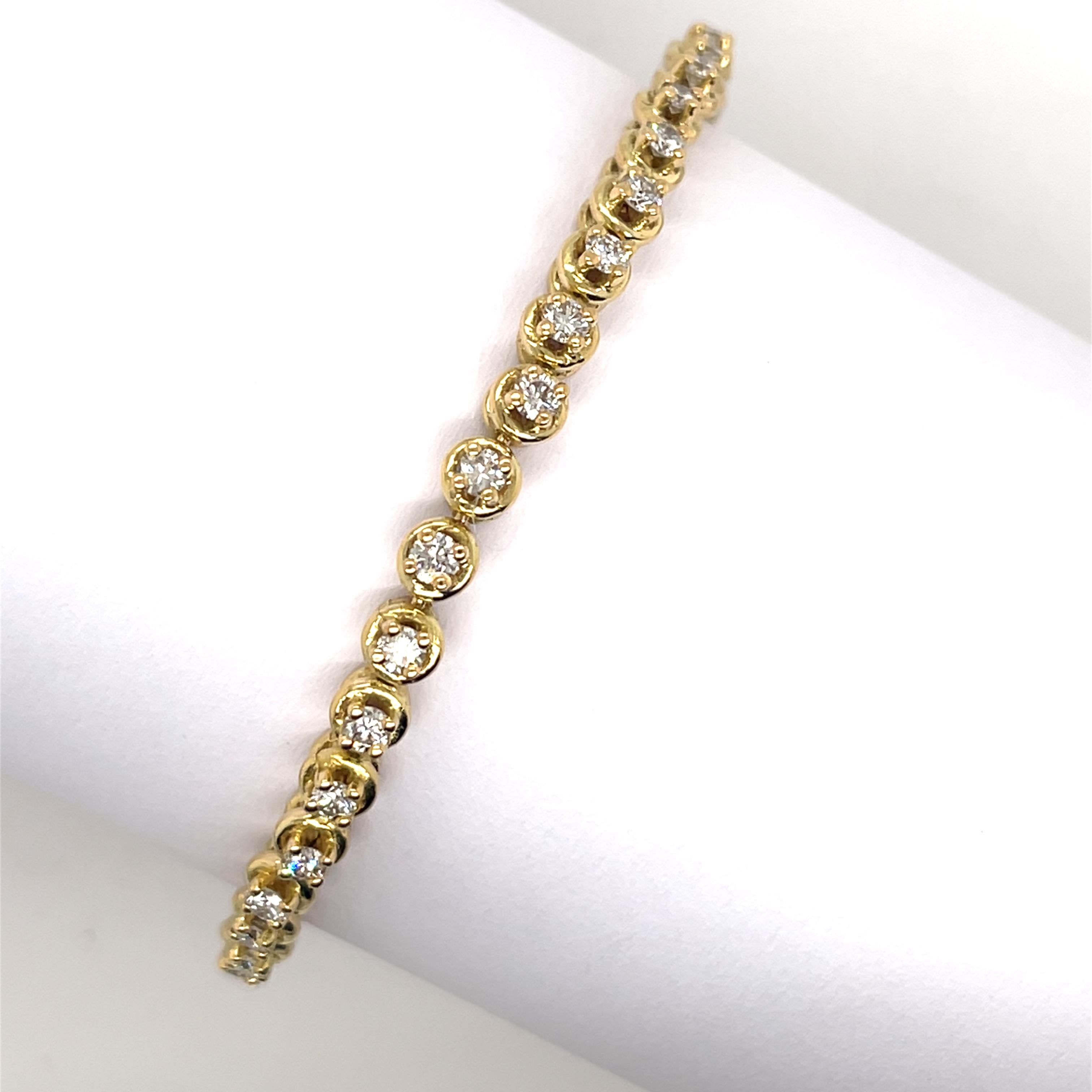 A stunning tennis bracelet set with 1.80ct of natural diamonds, crafted in 18ct yellow gold. The diamonds are expertly arranged in a continuous line, offering timeless elegance and exceptional brilliance. 
Perfect for special occasions or as a