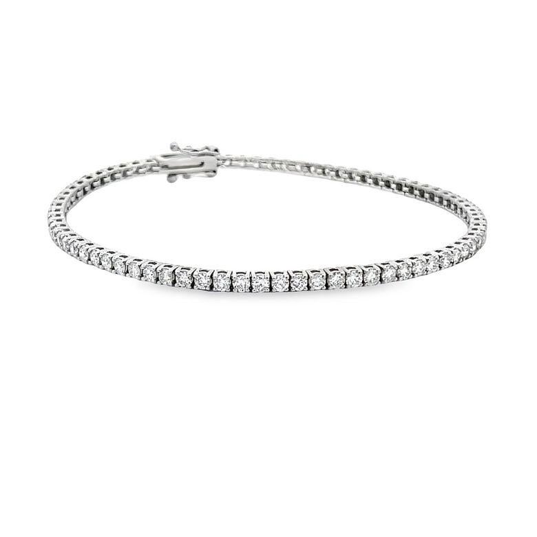 This exquisite tennis bracelet is a must-have for your jewelry collection. It is made from high-quality 14K white gold which has been polished to perfection, giving it a radiant and luxurious appearance. The bracelet features a stunning design that