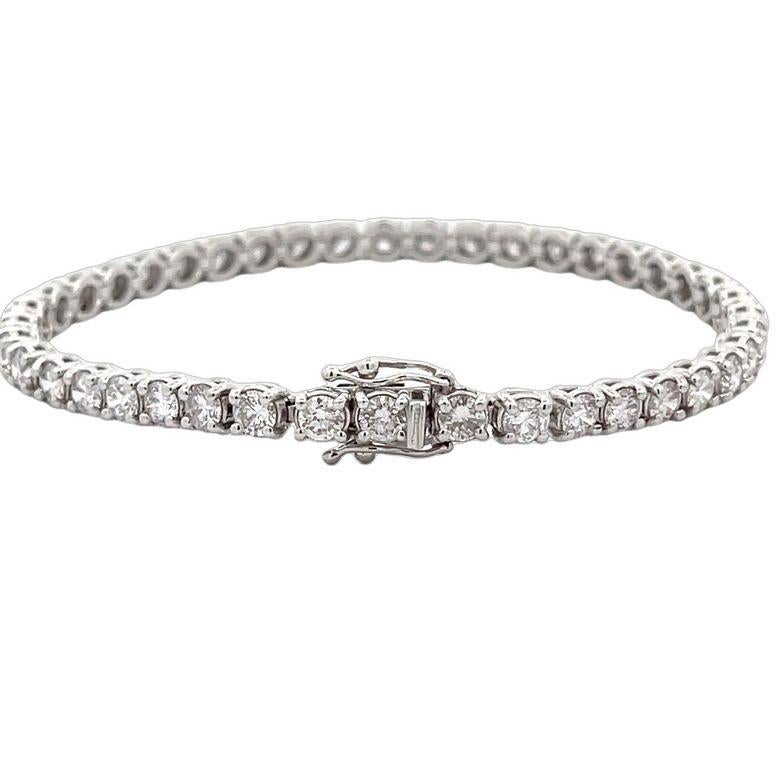 This exquisite tennis bracelet is a must-have for your jewelry collection. It is made from high-quality 14K white gold which has been polished to perfection, giving it a radiant and luxurious appearance. The bracelet features a stunning design that