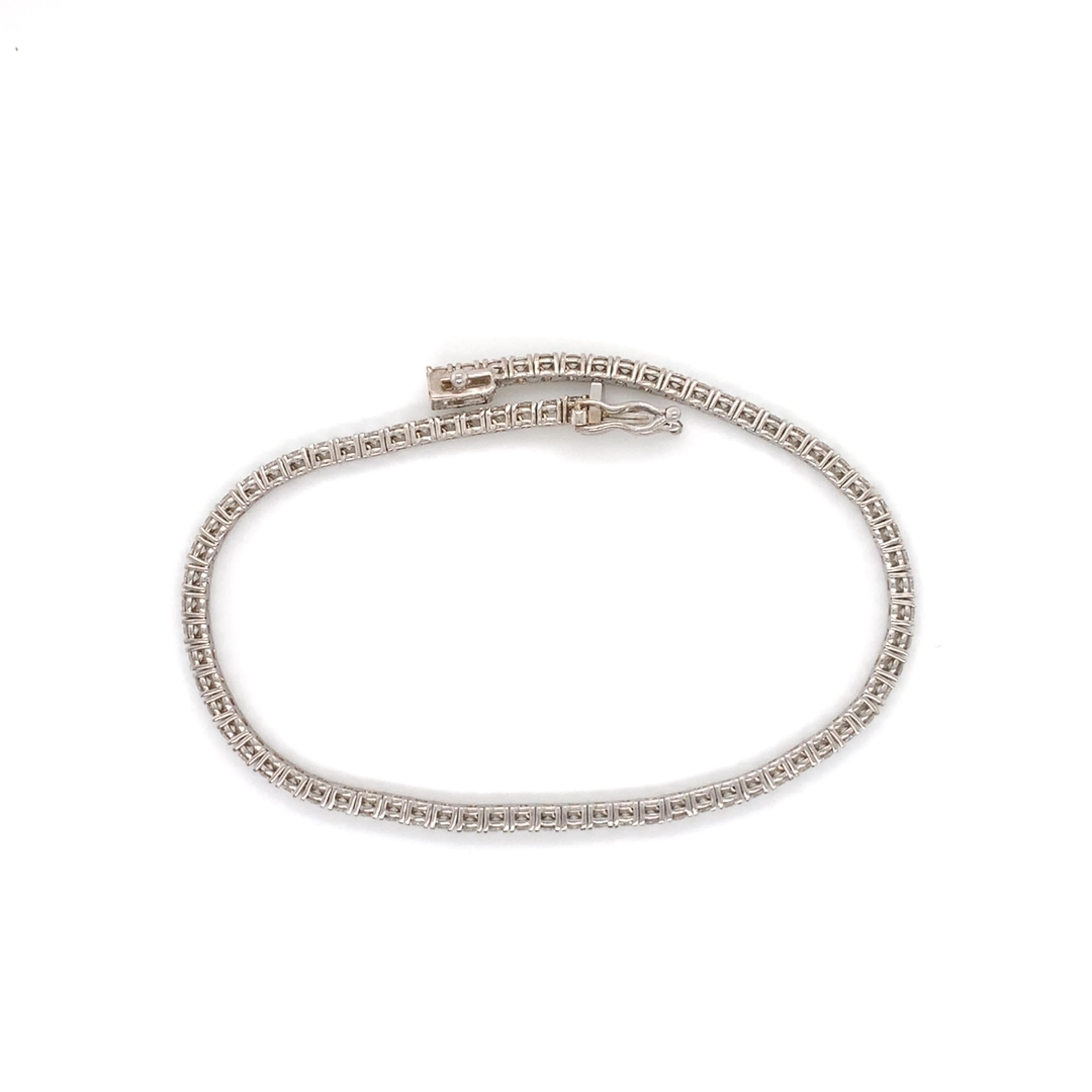 Medium sized diamond tennis/line bracelet made with real/natural diamonds. Total Diamond Weight: 2.46cts (brilliant cut diamonds). Diamond Quantity: 76. Mounted on 18kt white gold.