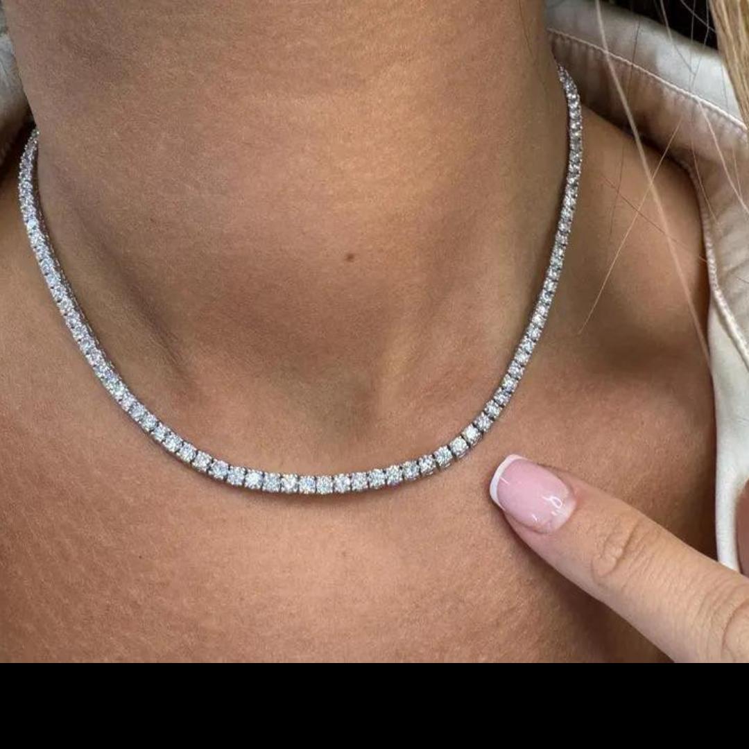 14 Karat white gold tennis necklace featuring 131 round brilliants weighing 11.53 carats, averaging 0.08 points. Color G-H Clarity VS2-SI1

More Tennis Necklaces in Stock. Smaller & Bigger Diamonds. 
Different Styles & Designs.
Message for More