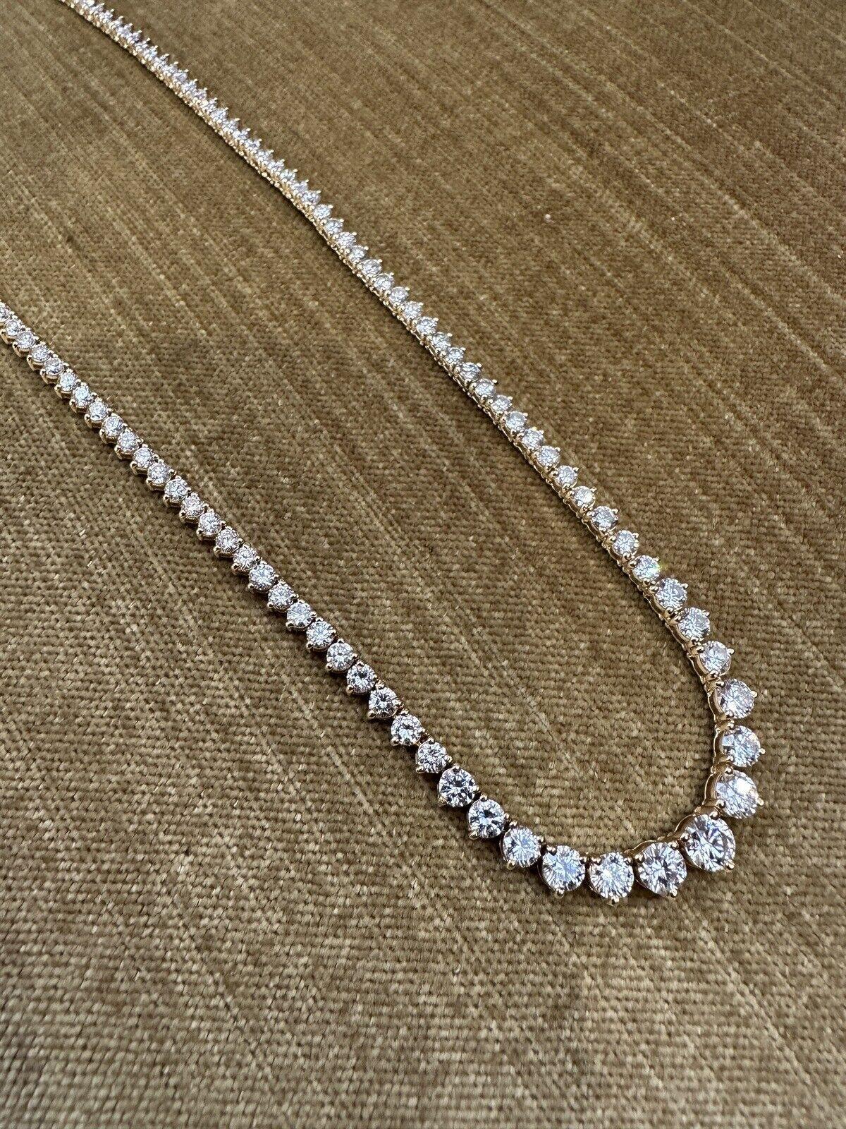 Graduated Diamond Tennis Necklace 11.64 Carats Total Weight in 18k Yellow Gold

Round Diamond Tennis Necklace features 140 Round Brilliant Diamonds 3-prong set in 18k Yellow Gold. 
Diamonds are graduated in sizes.

Total diamond weight is 11.64
