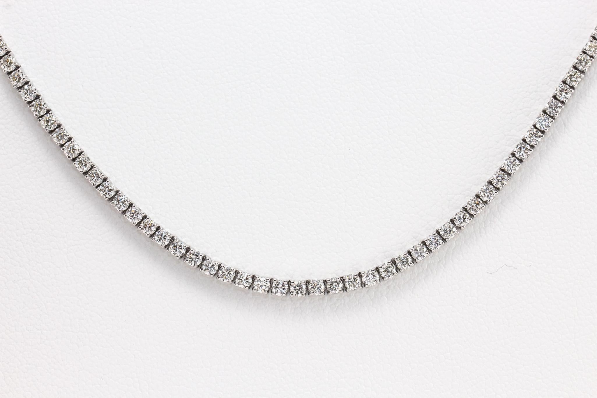 This is a luxurious 14K White Gold Diamond Tennis Necklace with 268 Round Brilliant Cut Diamonds, approximately 9.47ctw, G-H in Color, VS-I1 in Clarity. A stunning Necklace that sparkles for 24 inches around the neck making a statement. The Necklace