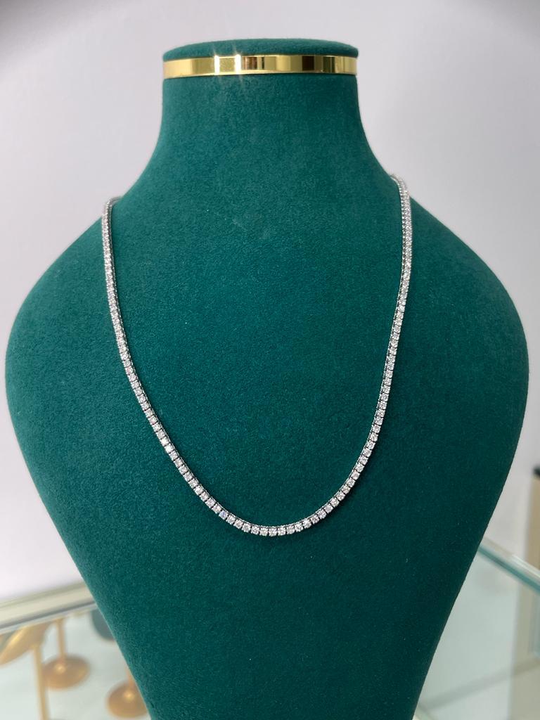This diamond tennis necklace features beautifully cut round diamonds set gorgeously in 14k gold.

Metal: 14k Gold
Diamond Cut: Round Natural (Not Lab Grown or Moissanite) 
Total Approx. Diamond Carats: 7ct
Diamond Clarity: VS
Diamond Color: