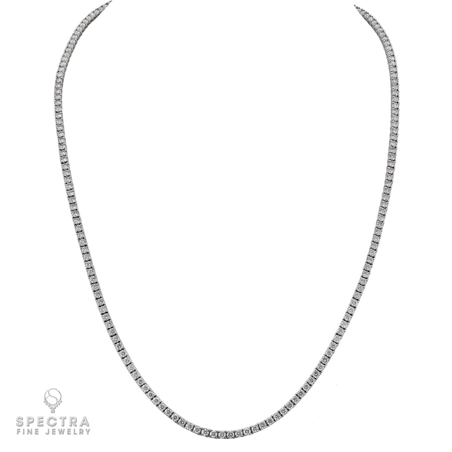 This exquisite diamond tennis necklace is a timeless expression of refined elegance. Designed in 14k white gold, it showcases 186 perfectly matched round brilliant-cut diamonds, weighing approximately 13.02 carats in total. Each diamond, weighing