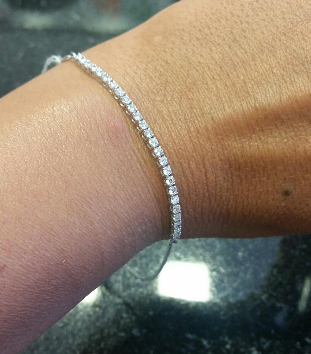 Hand Made Diamond Tennis Bracelet with adjustable closure. Our unique bracelet is set with 25 Round Brilliant cut high quality diamonds  0.94 Total Carat Weight G-I/ VS-SI. 
14K white gold.  Due to Covid 19 shipping time undetermined 
